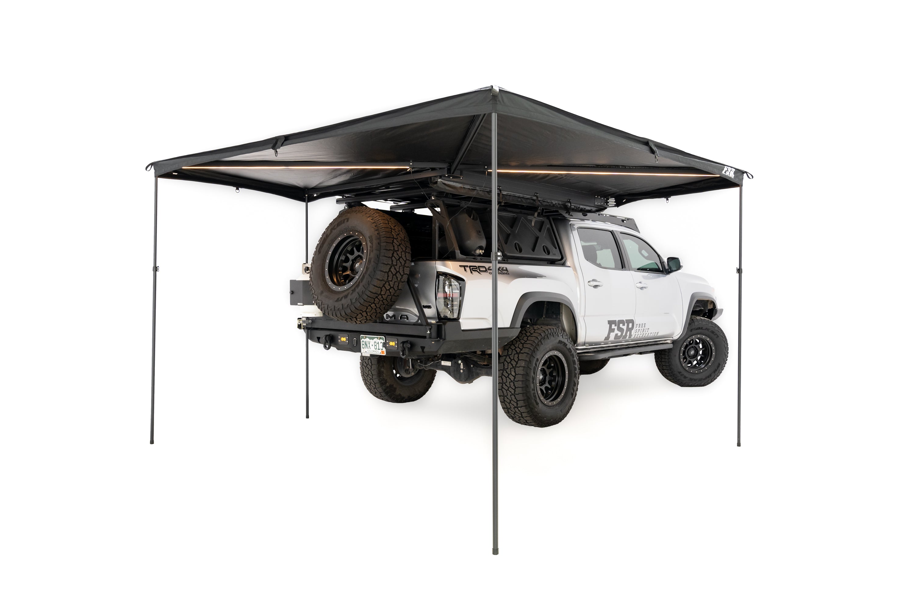 Photo of 270 V2 awning with optional support poles set up and displayed.