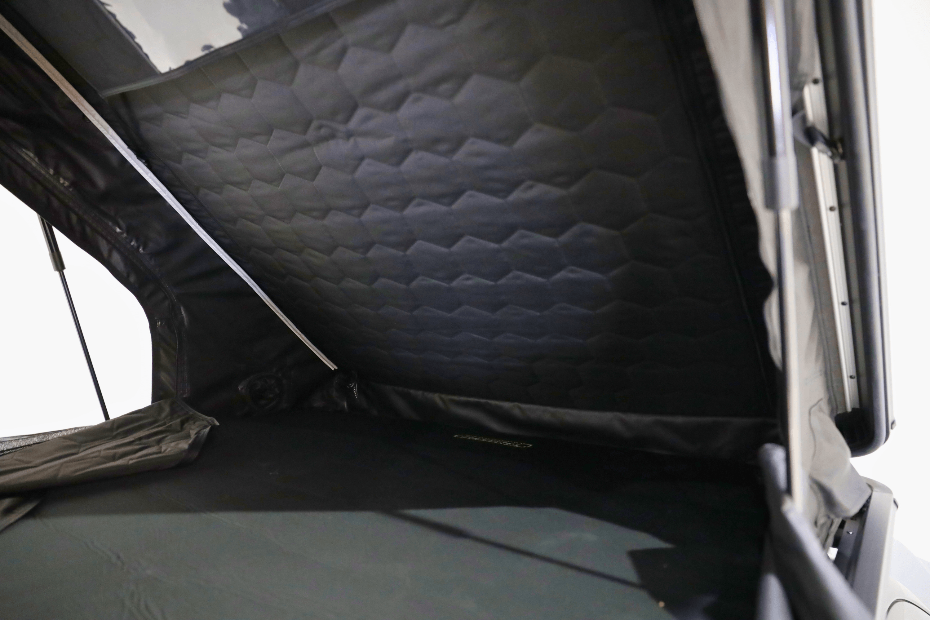 Interior photo of a deployed FSR Aspen V2 standard rooftop tent mounted on the bed of the short bed pickup.