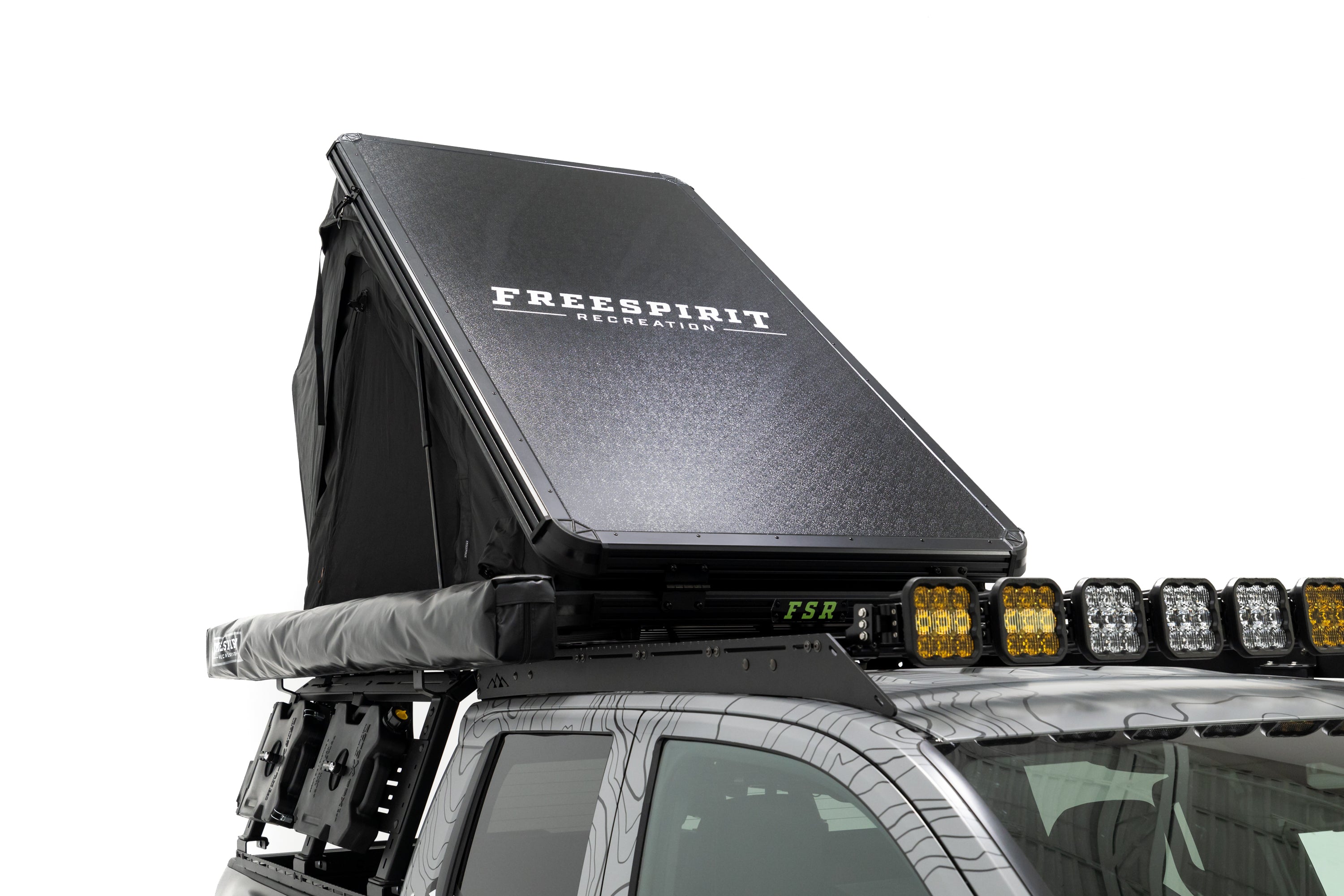 Close up photo of RCI Toyota Tacoma with FSR Aspen V2 standard rooftop tent mounted on the bed of the short bed pickup.