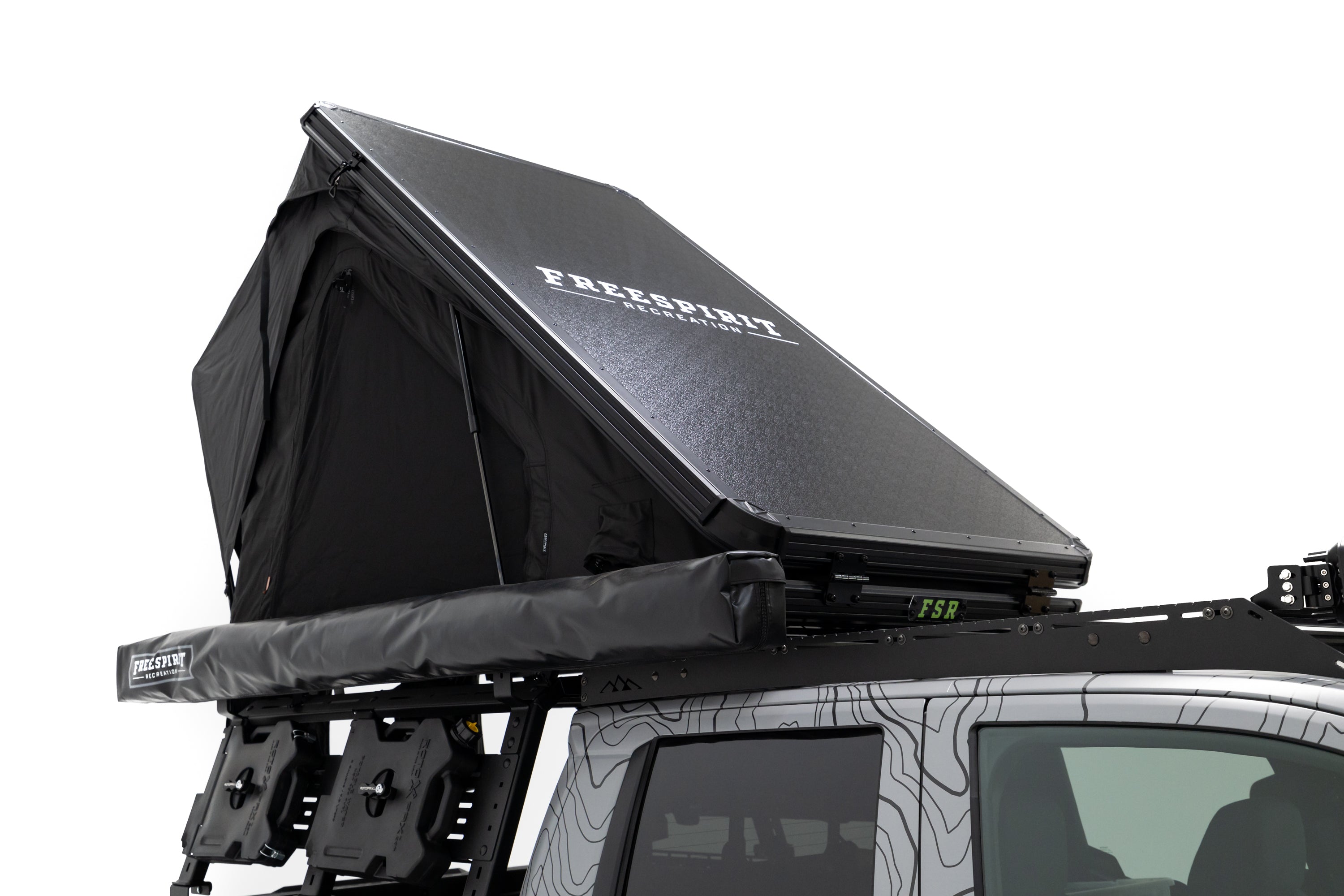 Close up photo of RCI Toyota Tacoma with FSR Aspen V2 standard rooftop tent mounted on the bed of the short bed pickup.
