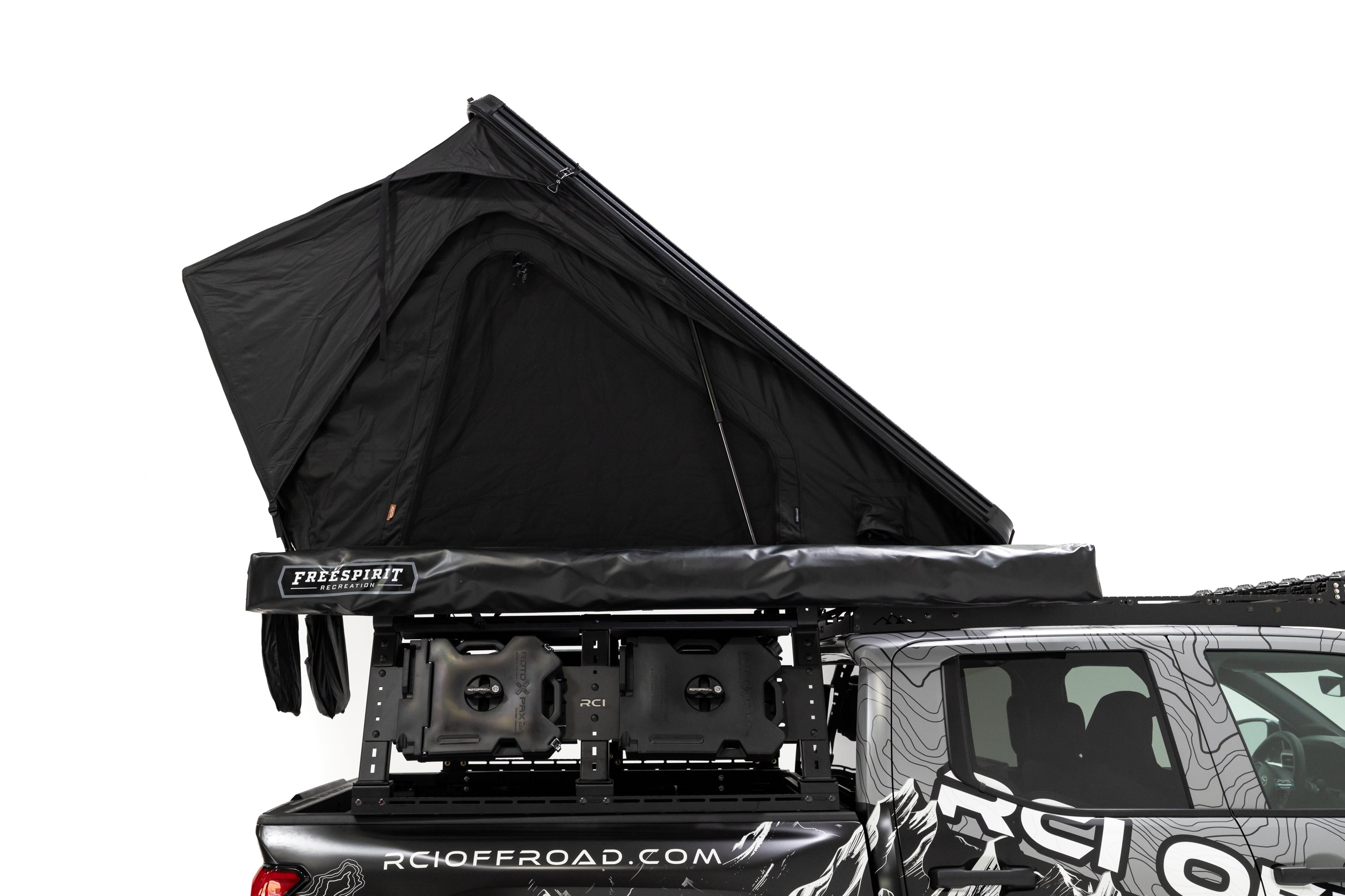 Passenger Side profile, close up photo of RCI Toyota Tacoma with a deployed FSR Aspen V2 standard rooftop tent mounted on the bed of the short bed pickup.