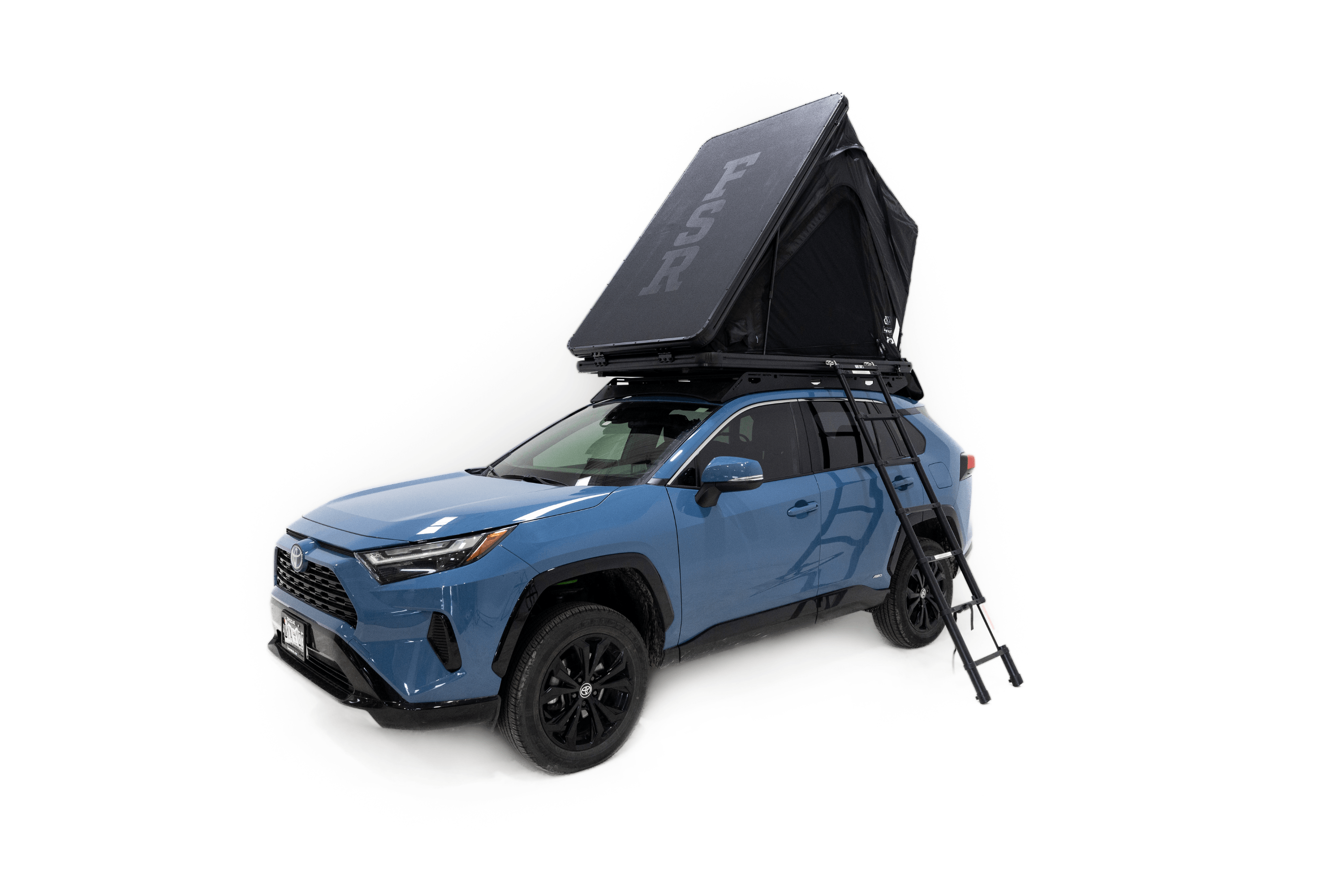 Photo of Aspen Lite Standard - Rooftop Tent by Freespirit Recreation deployed and mounted on a blue Toyota Rav4 with ladder deployed