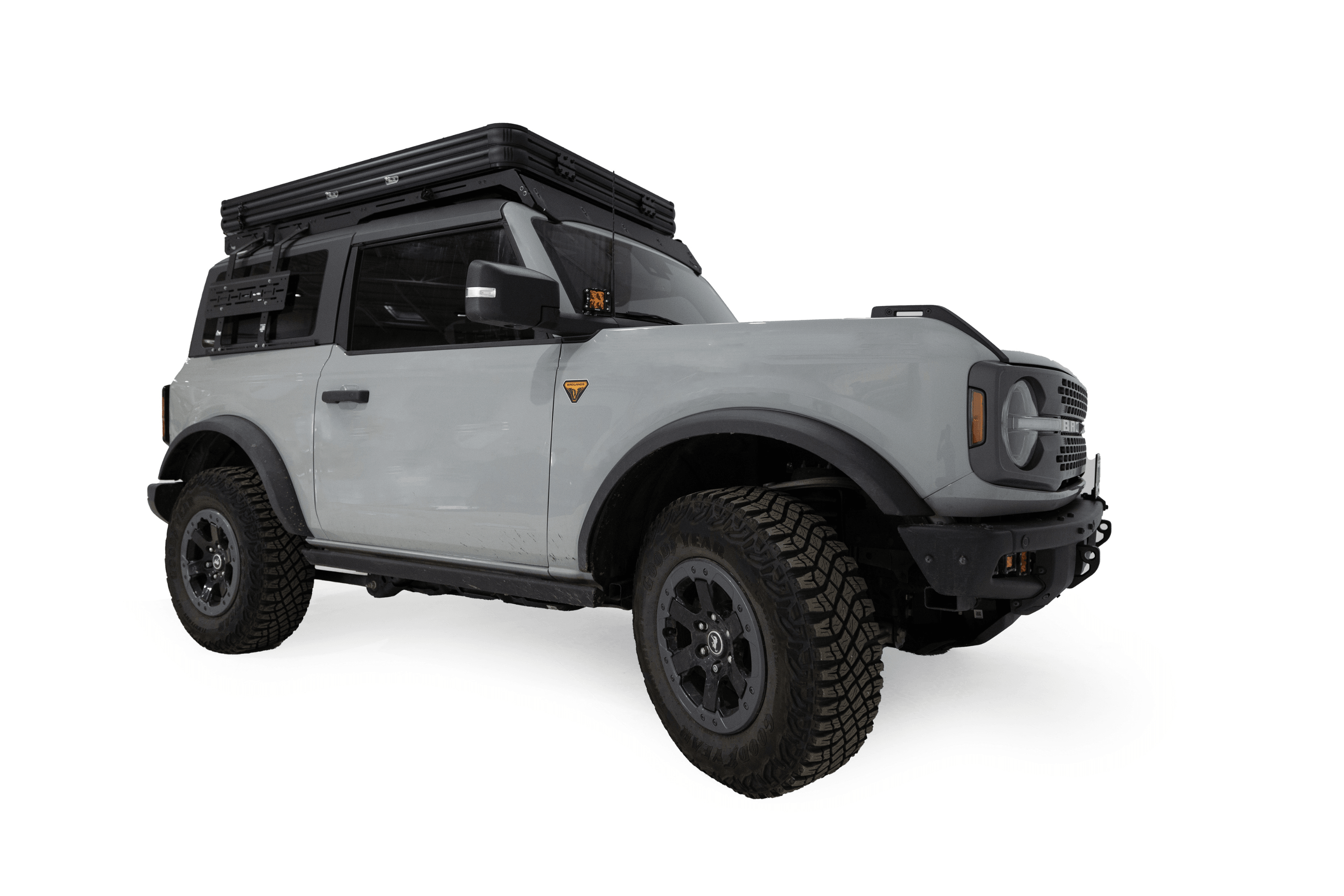 Exterior photo of the Aspen Lite Standard - Rooftop Tent by Freespirit Recreation mounted on a 2-door Ford Bronco in its closed position.
