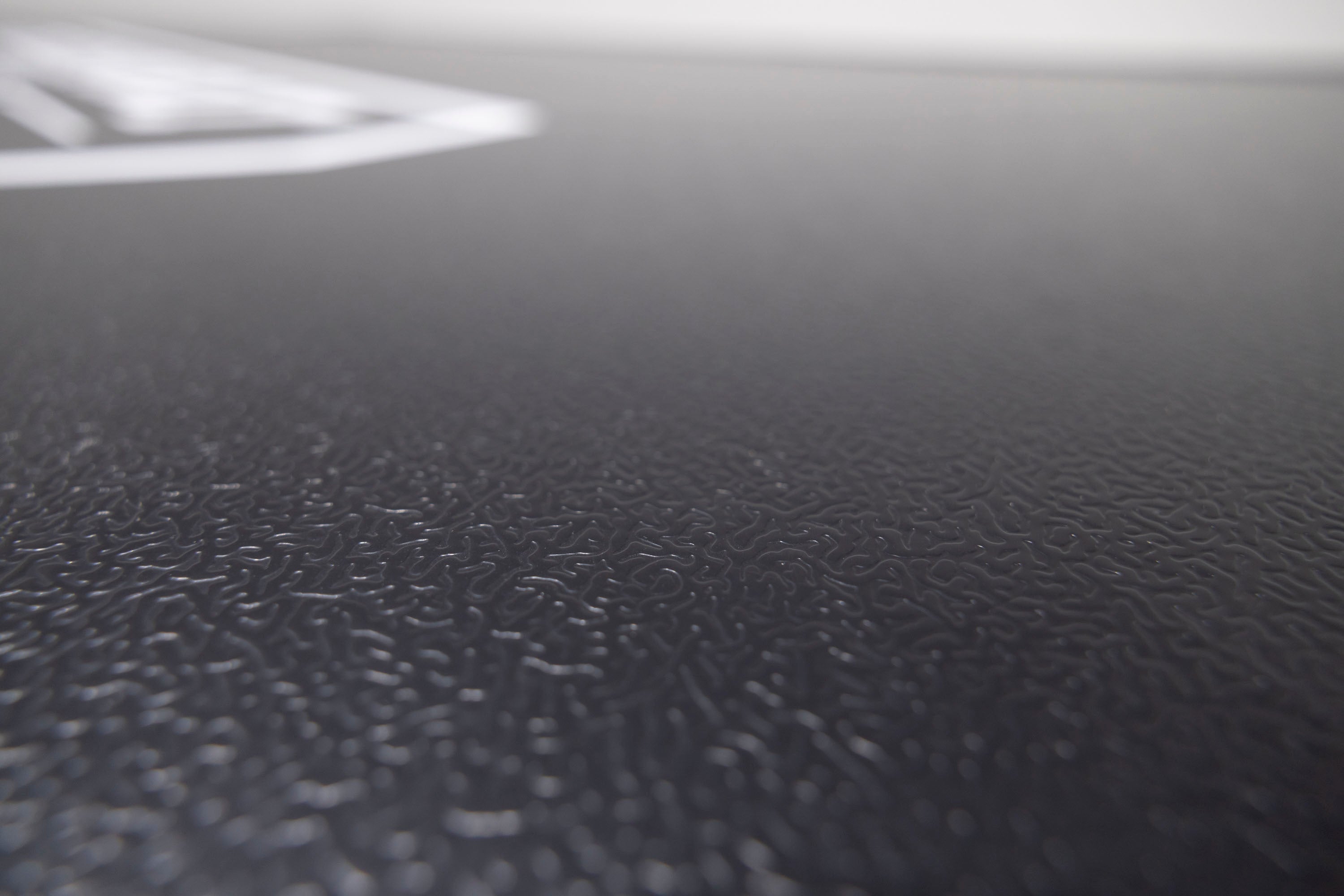 Up close photo of the honeycomb aluminum top shell on the Evolution V2 rooftop tent.