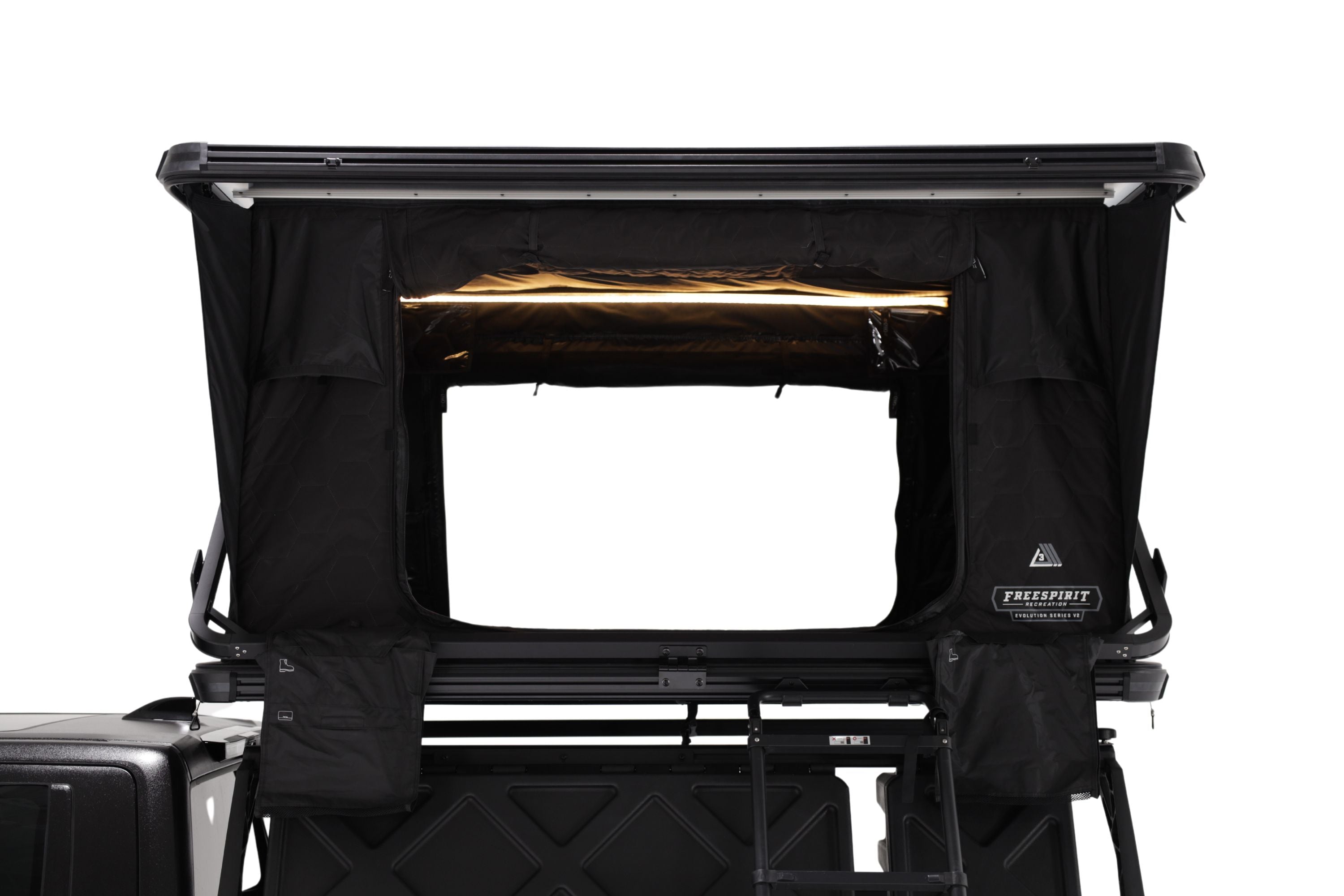 Photo of the Evolution V2 XL rooftop tent deployed with windows open and dimmable LED light turned on.