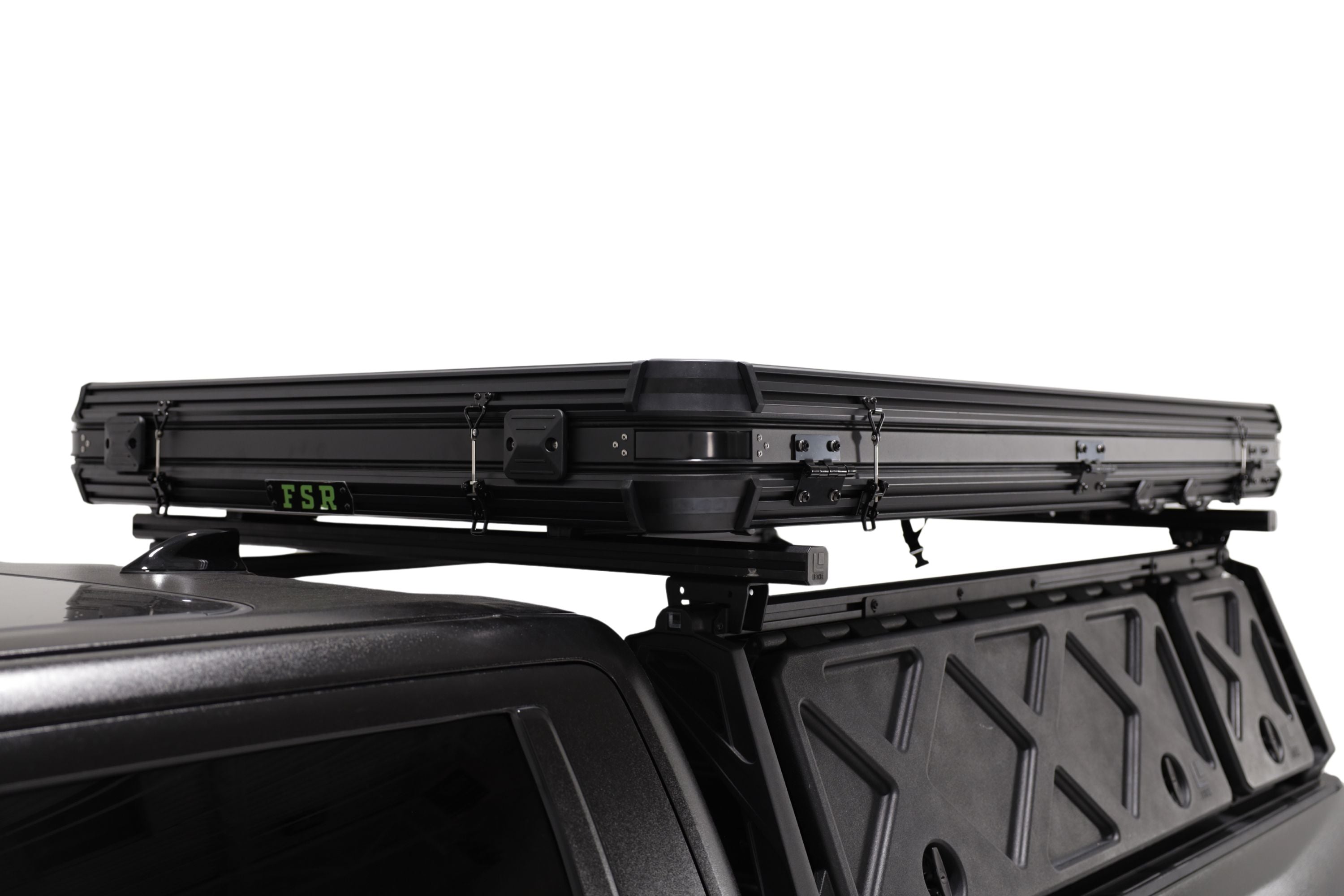 45 degree angle photo of the Evolution V2 XL closed on the back of a Toyota Tundra and Leitner Designs bed rack.