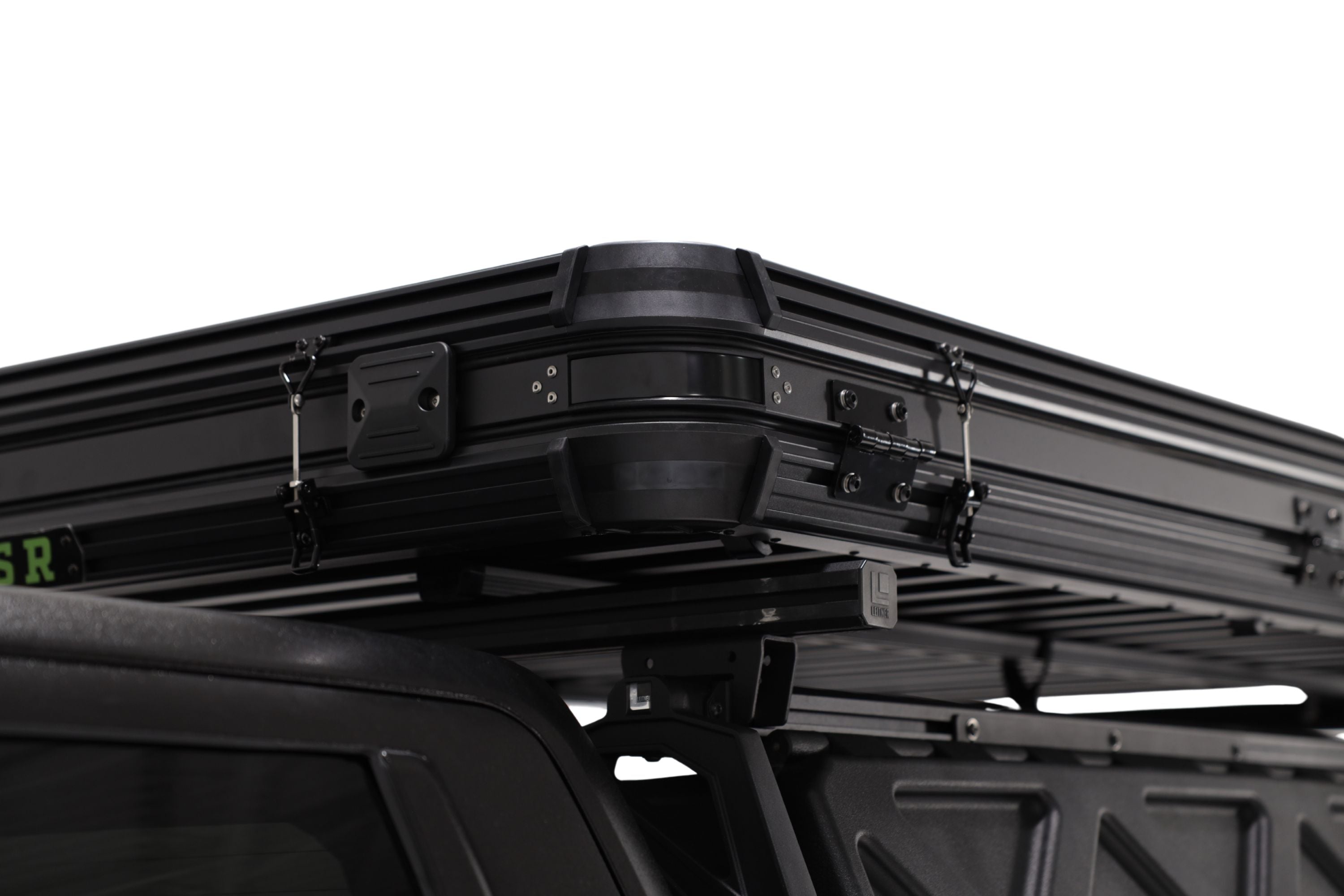 Up close photo of the corner of the Evolution V2 XL rooftop tent by FSR mounted on a Leitner Designs bed rack.