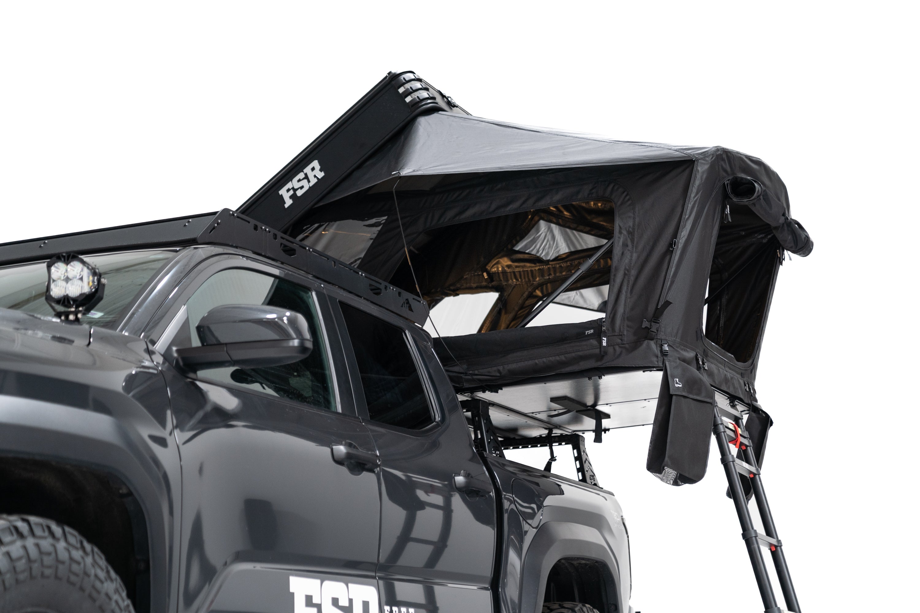Lower Exterior Photo of Kali hardshell rooftop tent by FSR - Deployed on the truck bed of a 4th gen Toyota Tacoma.