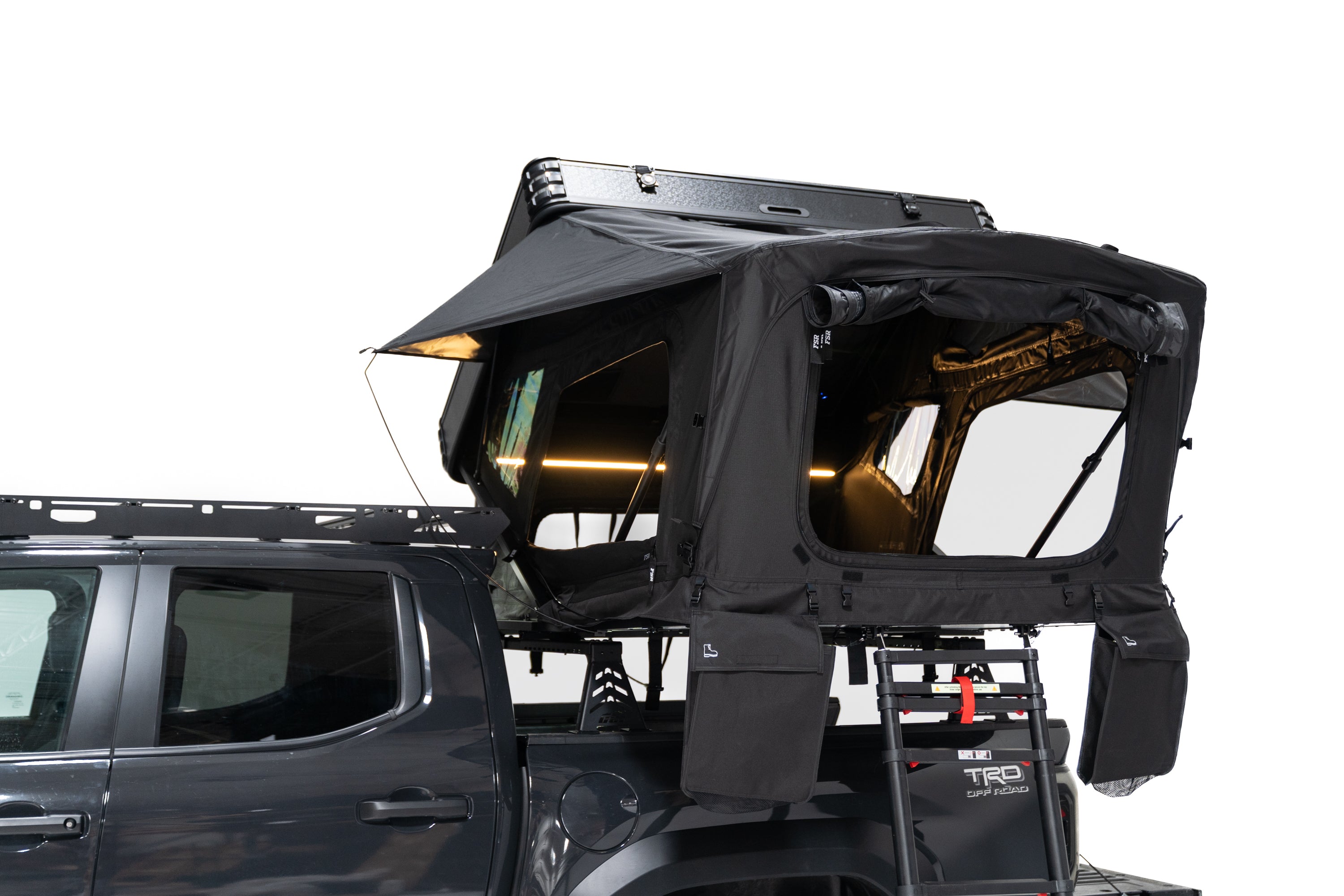 Close up side profile Exterior Photo of Kali hardshell rooftop tent by FSR - Deployed on the truck bed of a 4th gen Toyota Tacoma.
