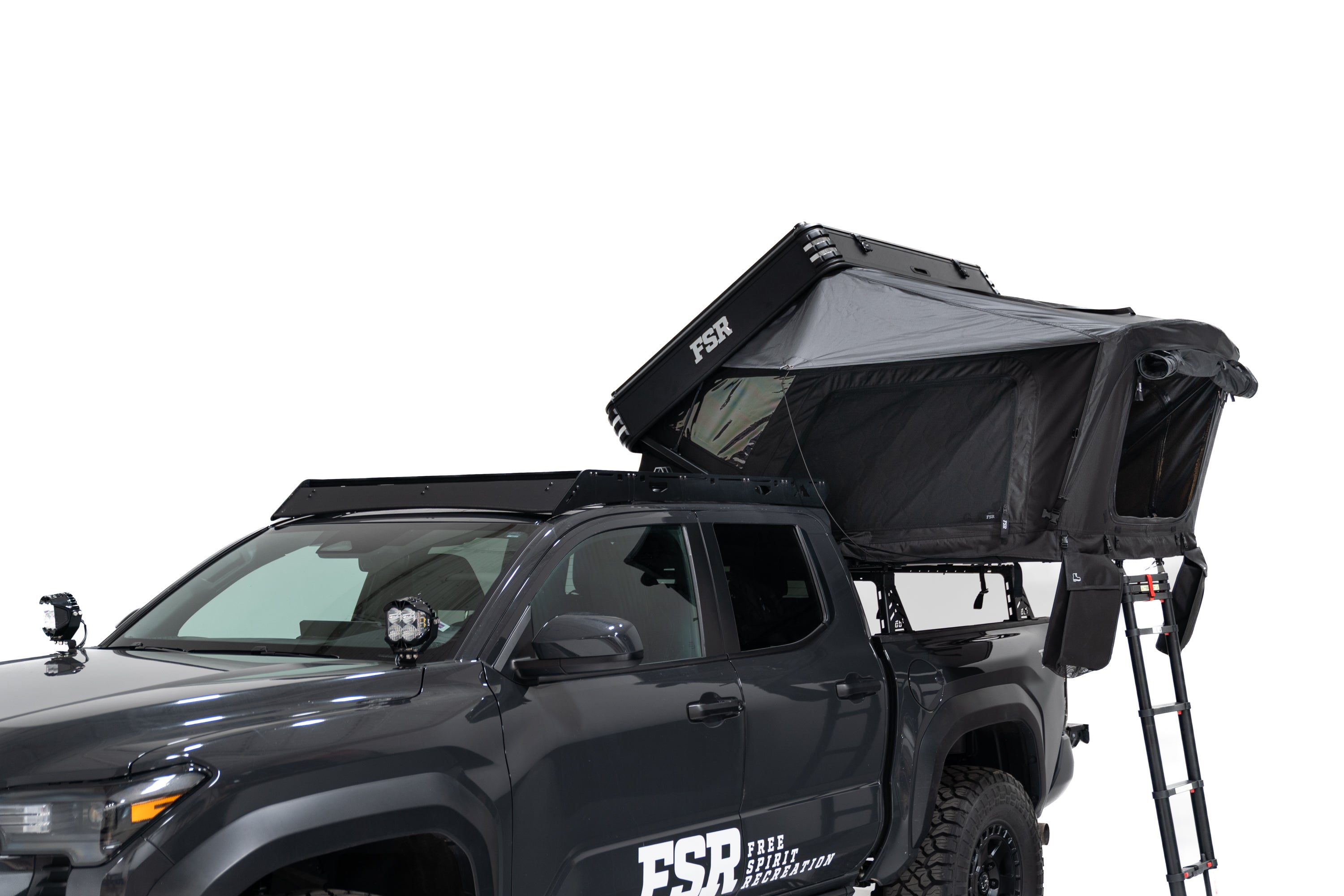 Exterior Photo of Kali hardshell rooftop tent by FSR - Deployed on the truck bed of a 4th gen Toyota Tacoma with all the windows closed.