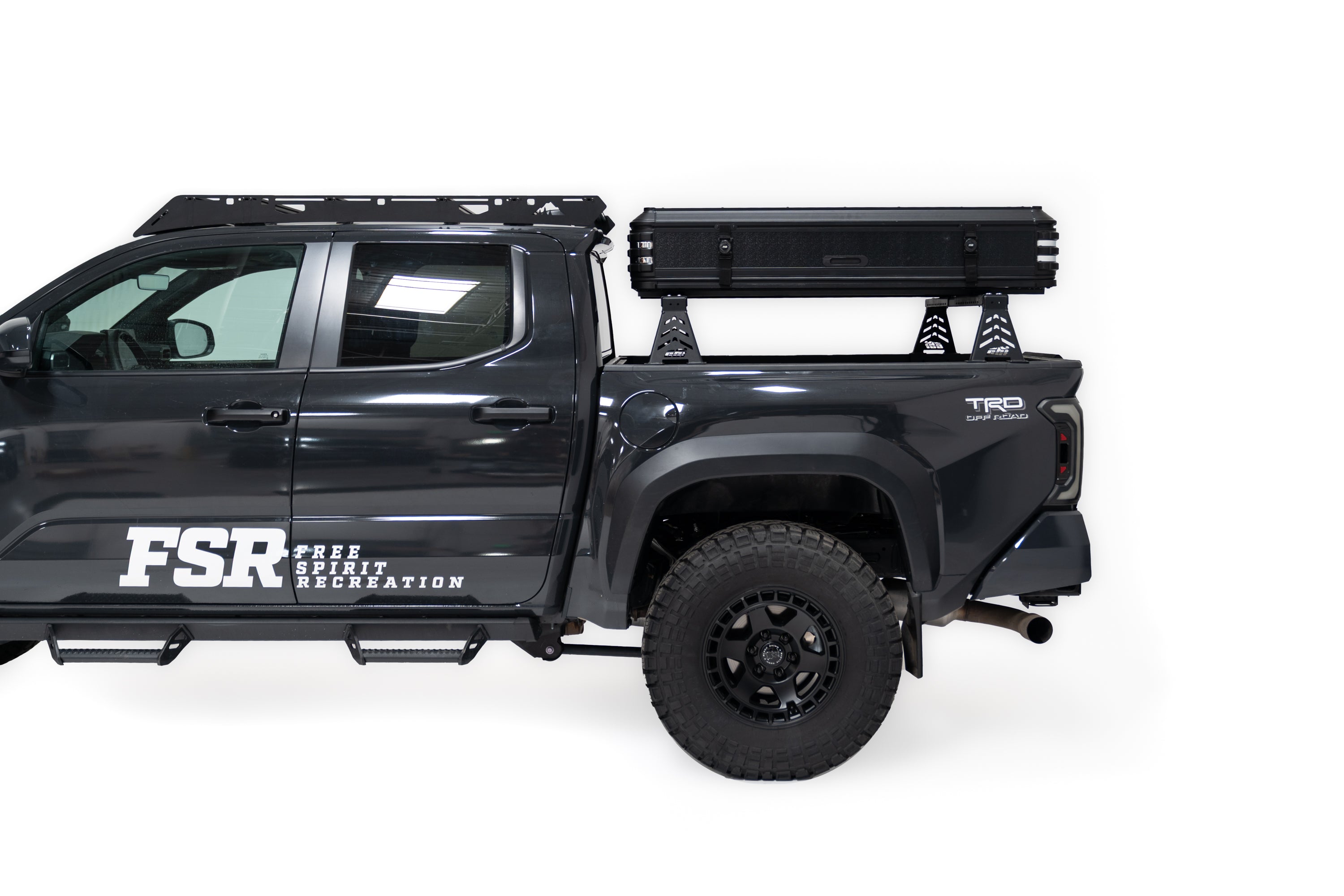 Zoomed out Exterior Photo of Kali hardshell rooftop tent by FSR - Closed on the truck bed of a 4th gen Toyota Tacoma.