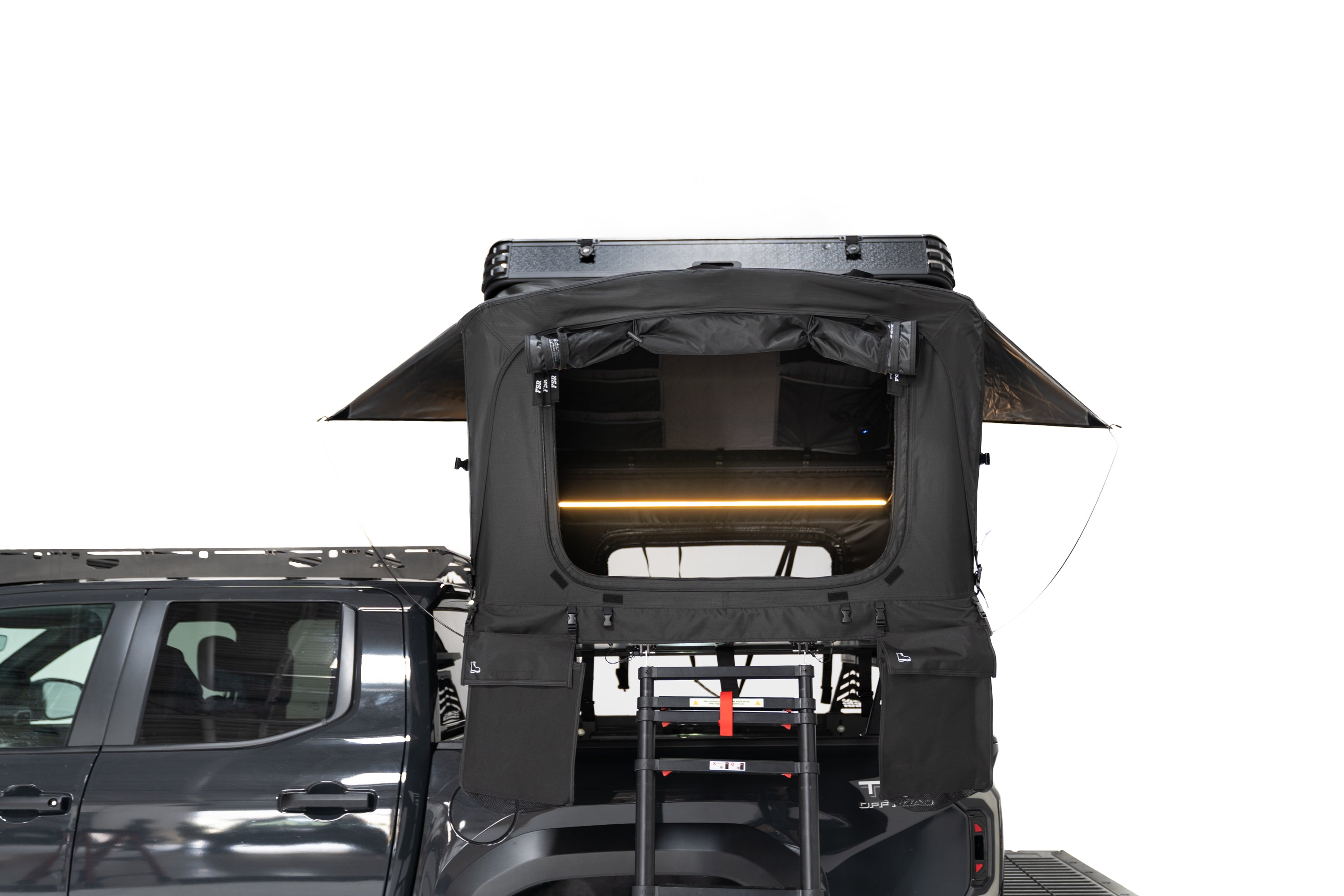 Exterior Photo of Kali hardshell rooftop tent by FSR showing the interior from the outside of the tent - Deployed on the truck bed of a 4th gen Toyota Tacoma.