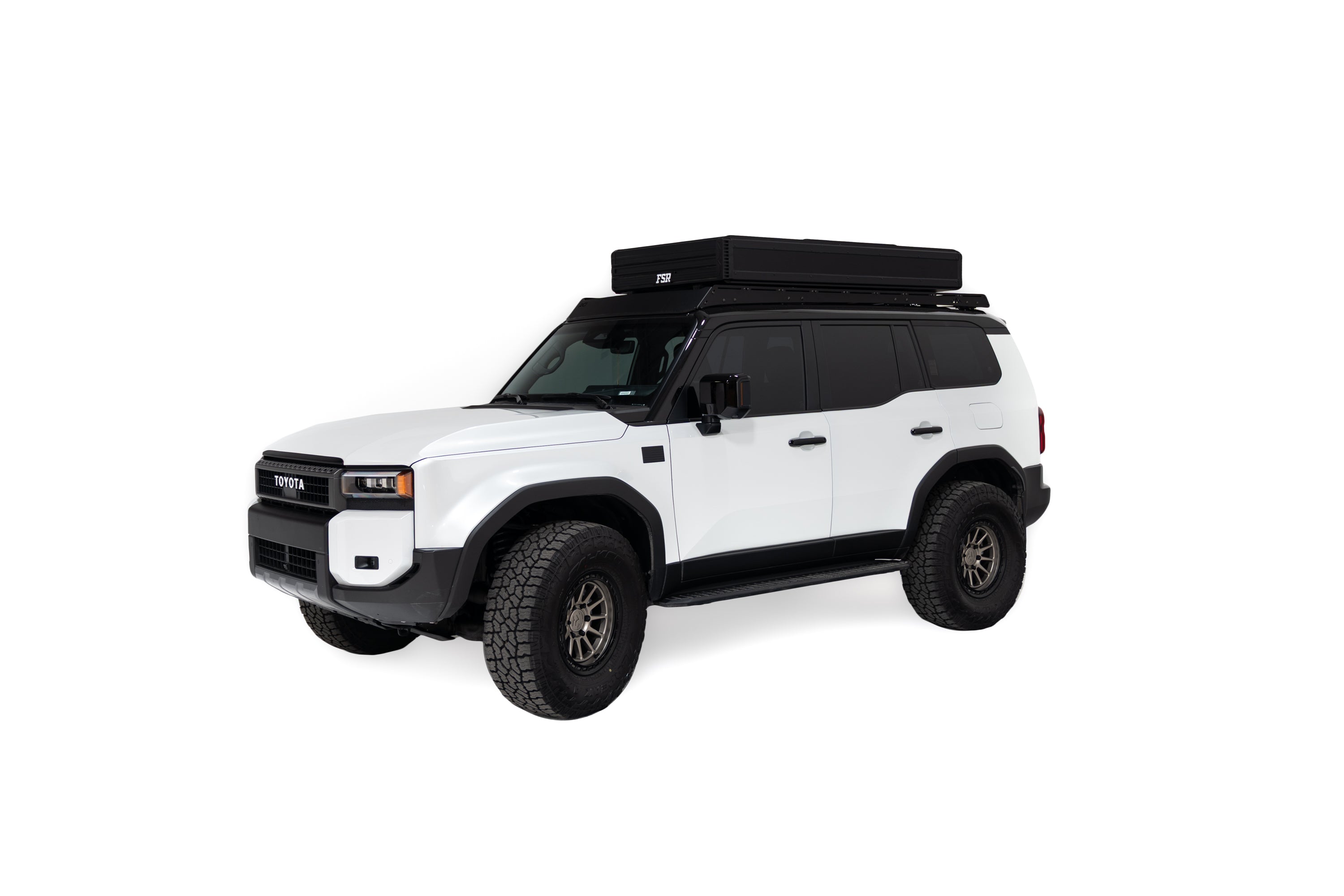 Exterior photo of the closed Nova King rooftop tent mounted on a white Toyota land cruiser.