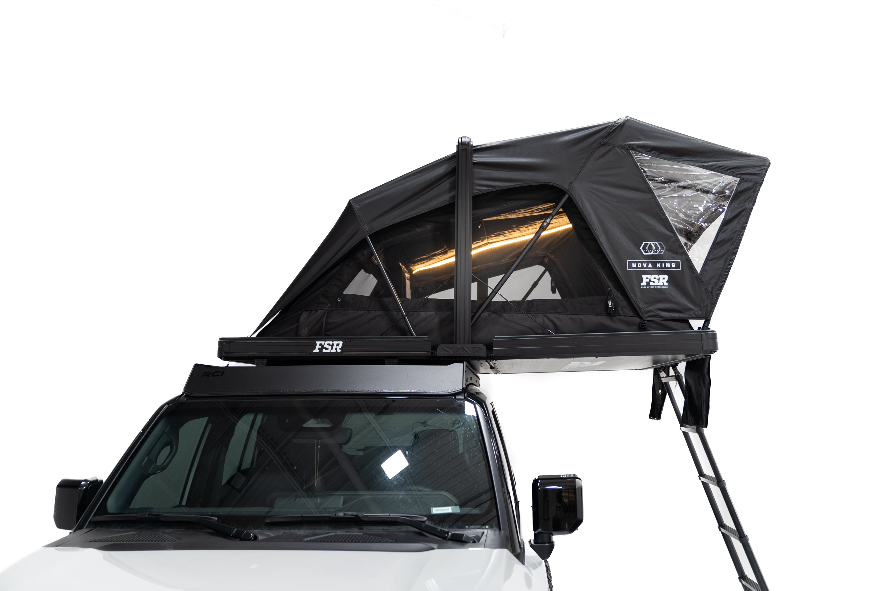 Side profile Close up Exterior photo of the Nova King rooftop tent mounted on a white Toyota land cruiser with the tent windows open and lights on.