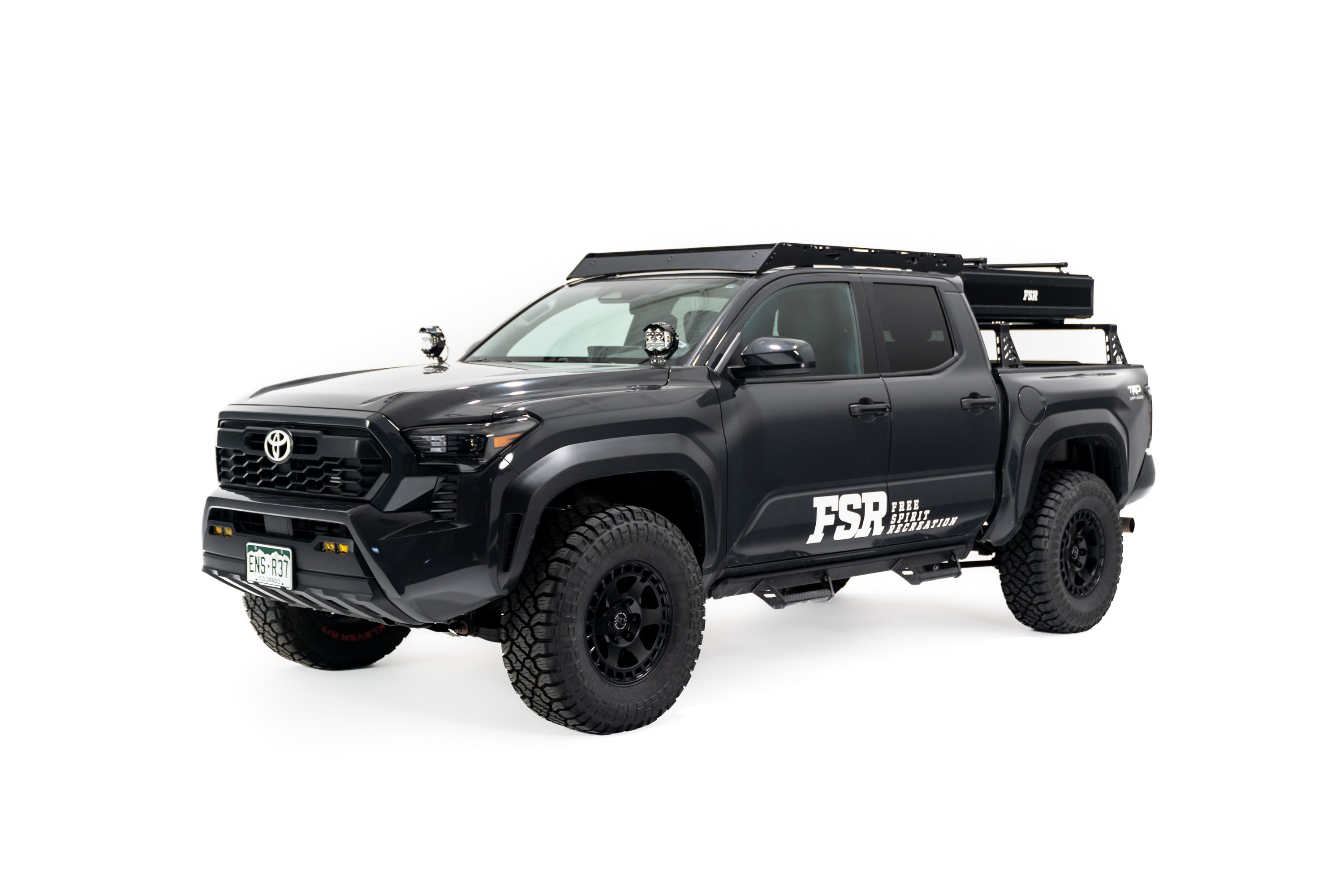 Photo of Nova Hybrid rooftop tent closed on the rear of a 2025 Toyota Tacoma.