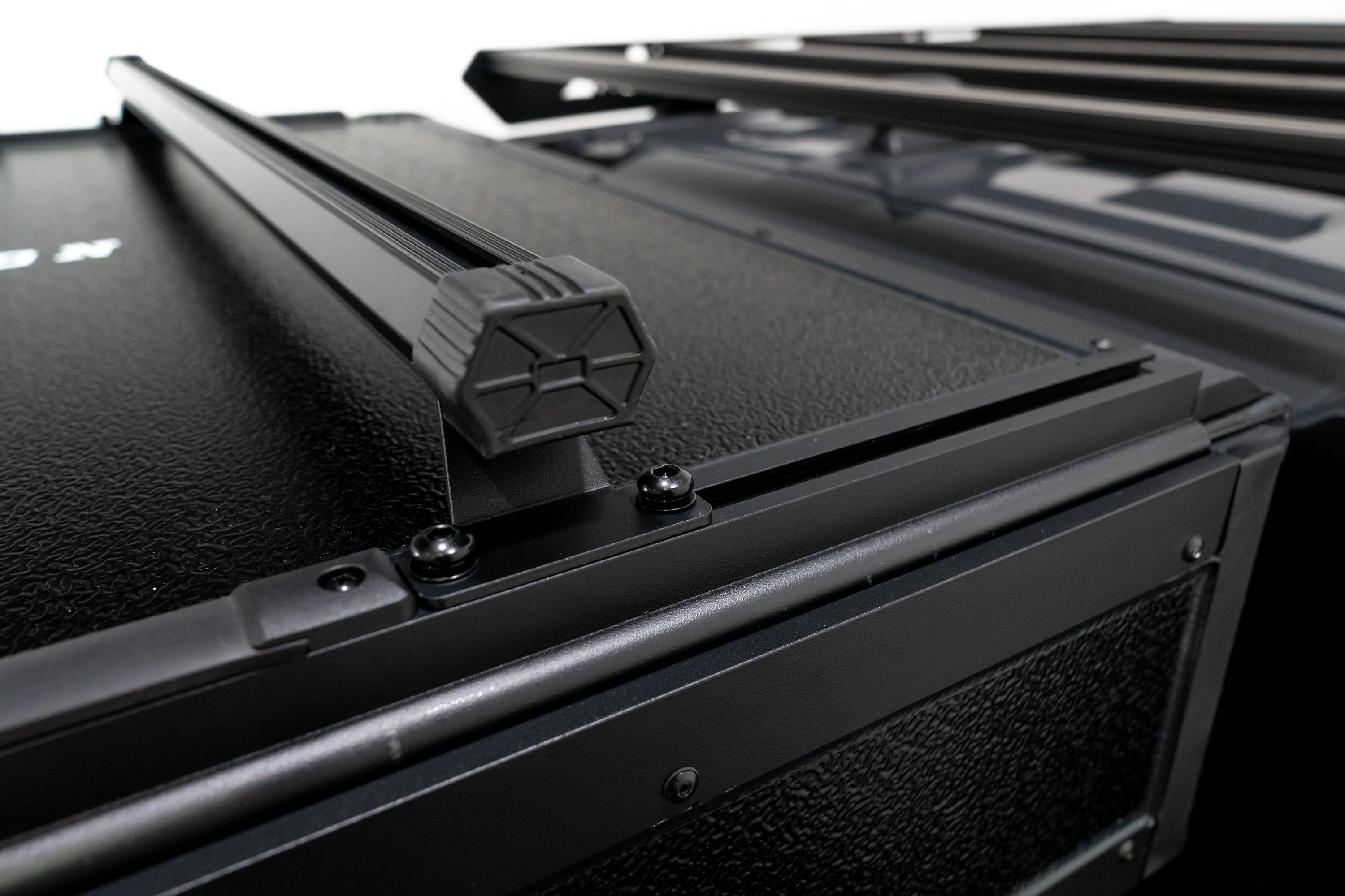 Up close Photo of FSR Nova Hybrid rooftop tent crossbars closed.