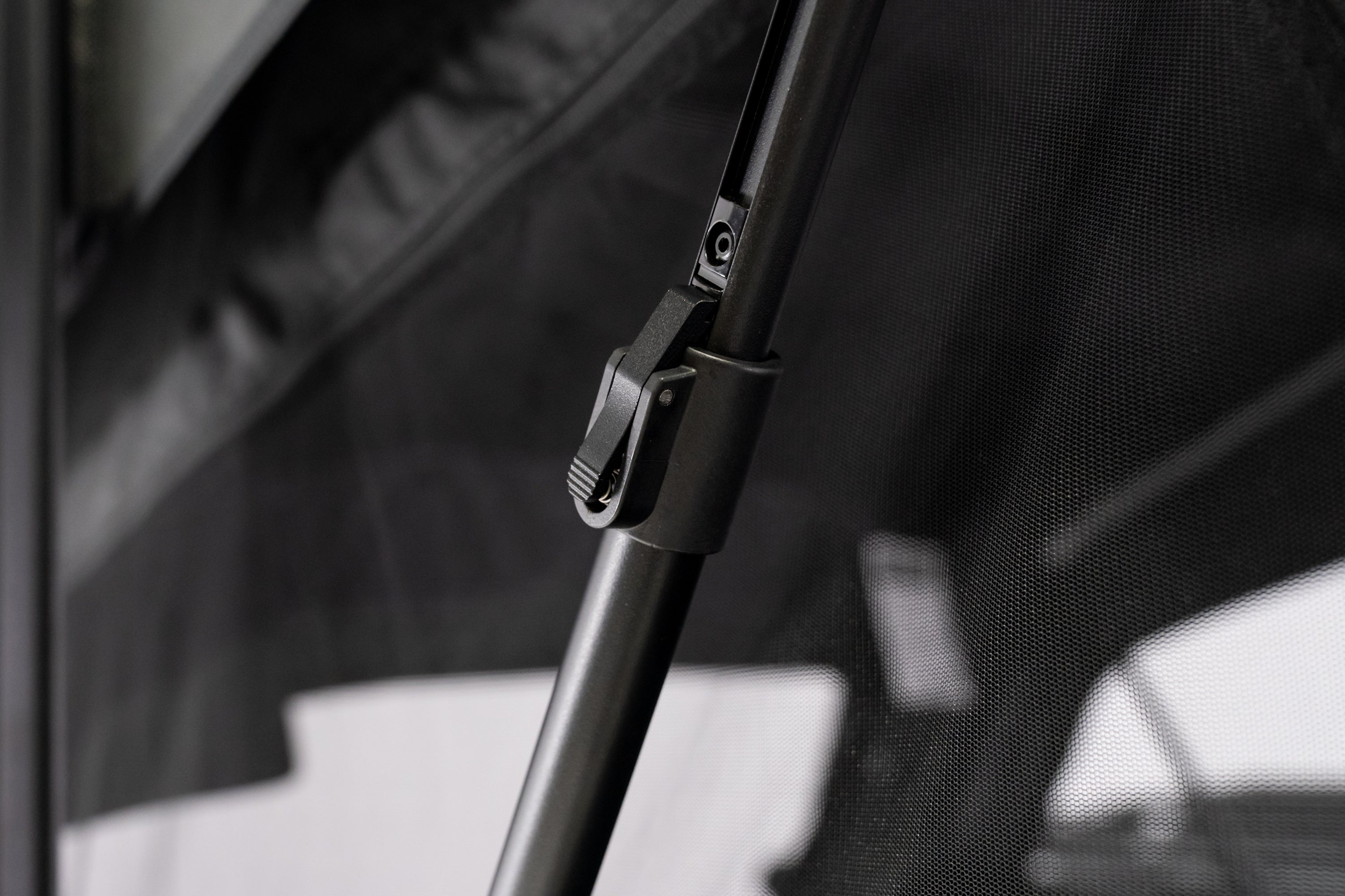 Up close photo of the adjustable u-bar on the FSR Nova Hybrid rooftop tent.