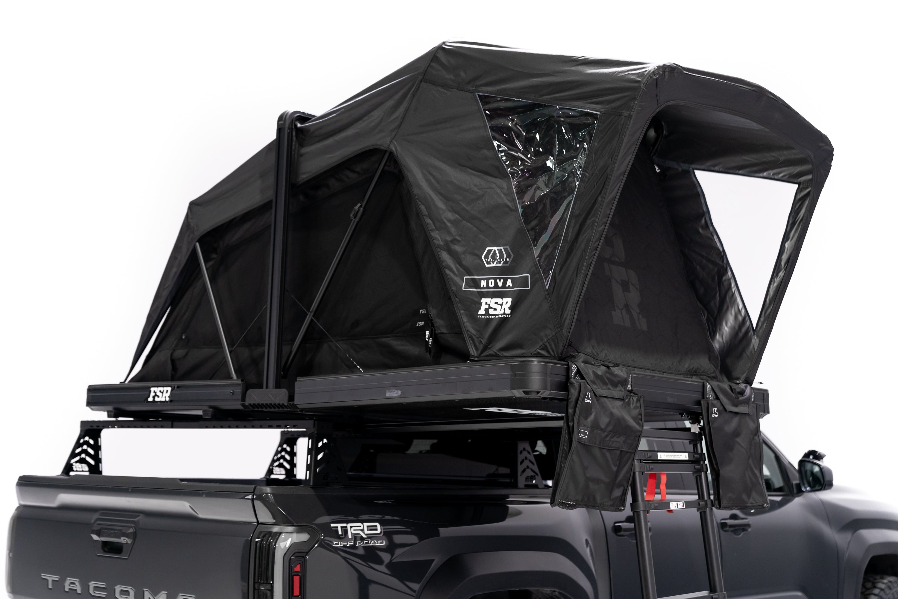 Photo of Nova Hybrid rooftop tent deployed on the rear of a 2025 Toyota Tacoma with all the doors and windows closed.