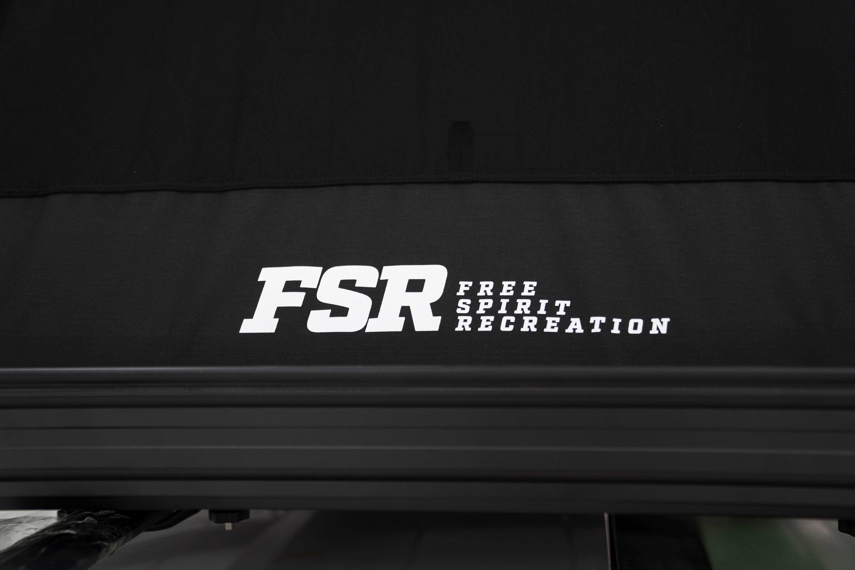 Up close rear photo of FSR Nova Hybrid rooftop tent branding.