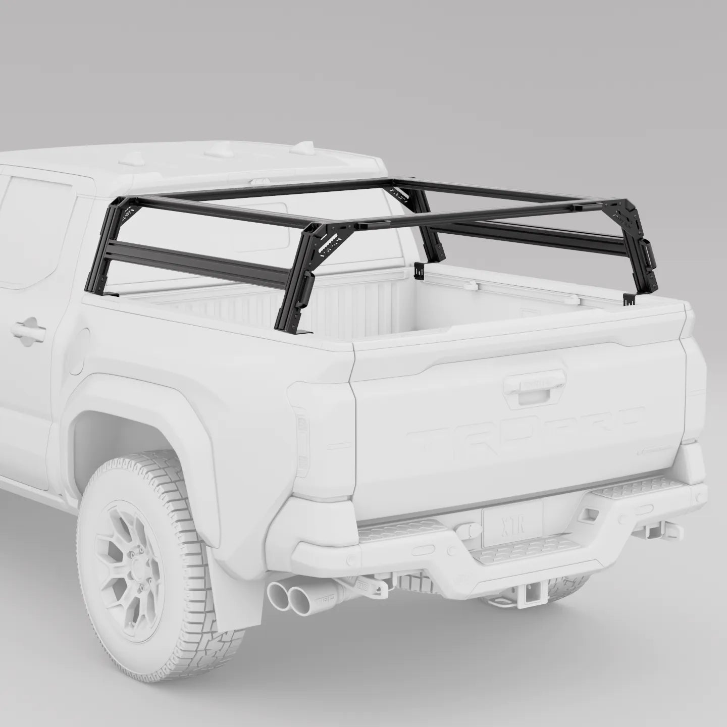 White pickup truck with a black xtrusion overland bed rack on a gray background