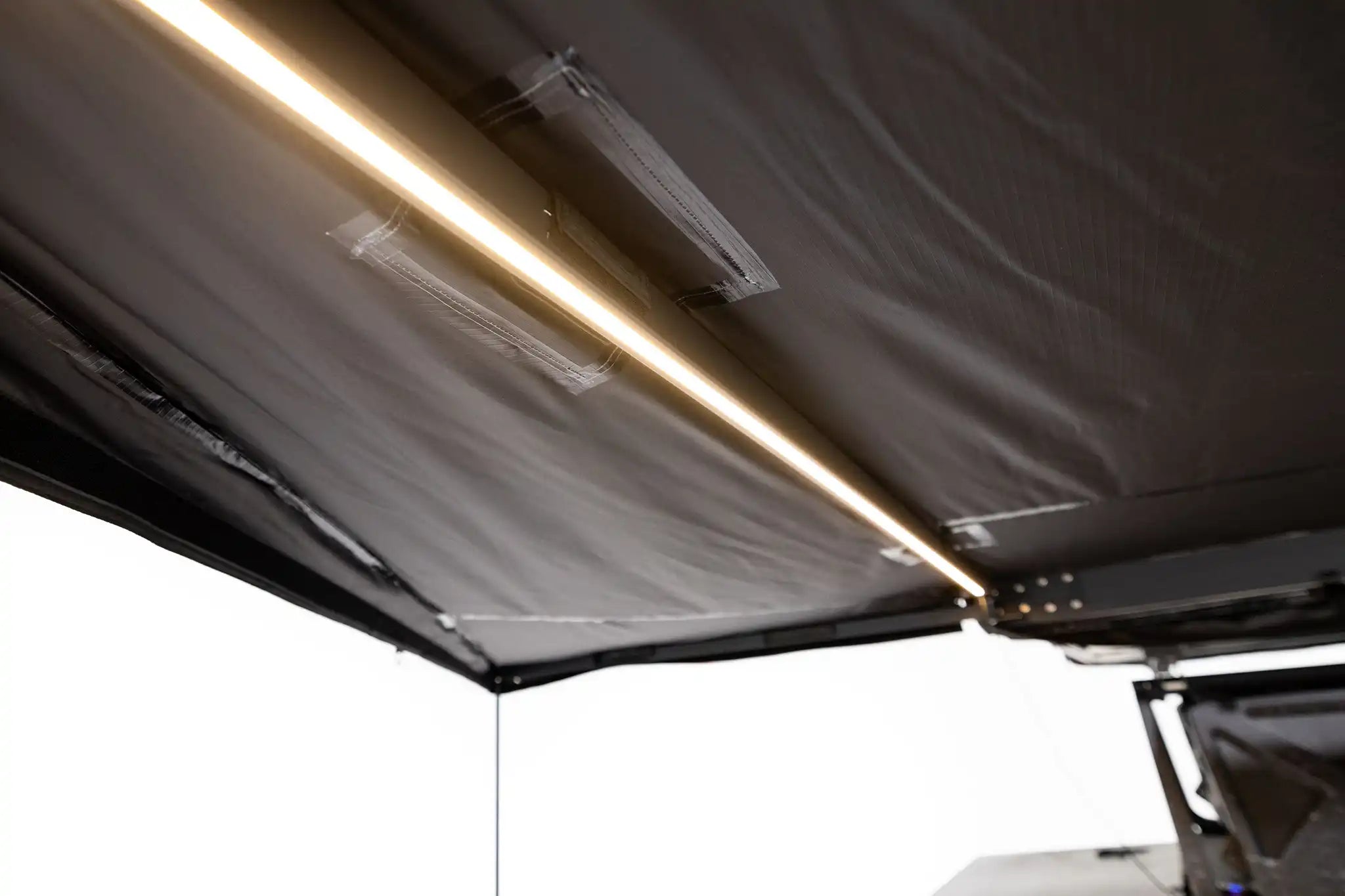 Close up of the illuminated built in LED lights on the FSR 180 Awning for camping, 4wd, suvs, and overland vehicles from Freespirit Recreation