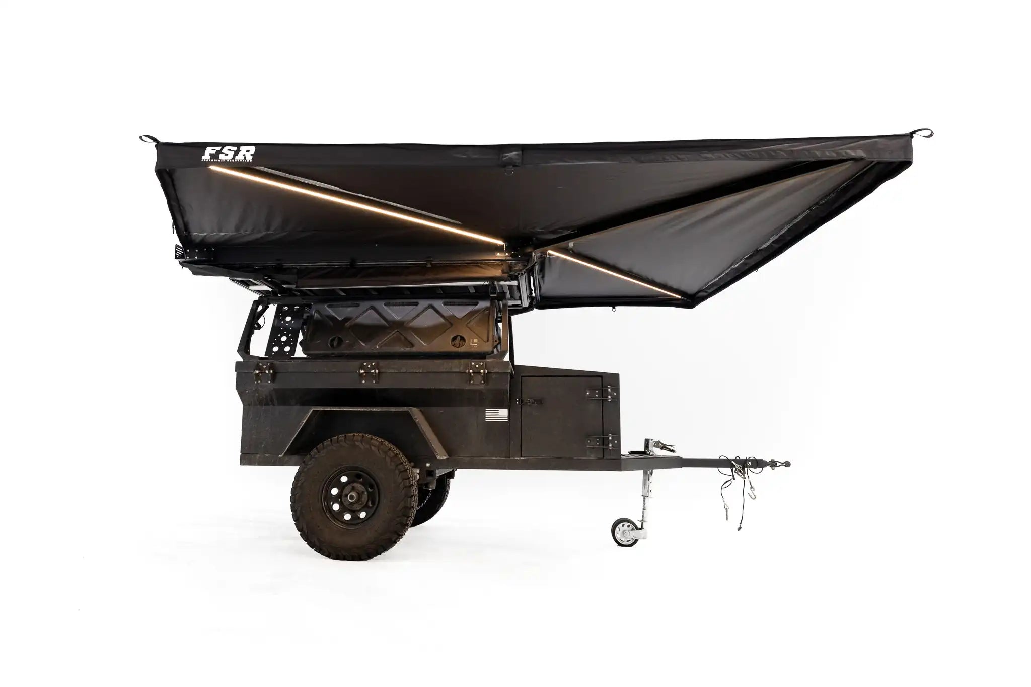 Photo of the unerside of the FSR 270 degree Awning by Freespirit Recreation deployed on an overland trailer with integrated, dimmable LED lights shown.