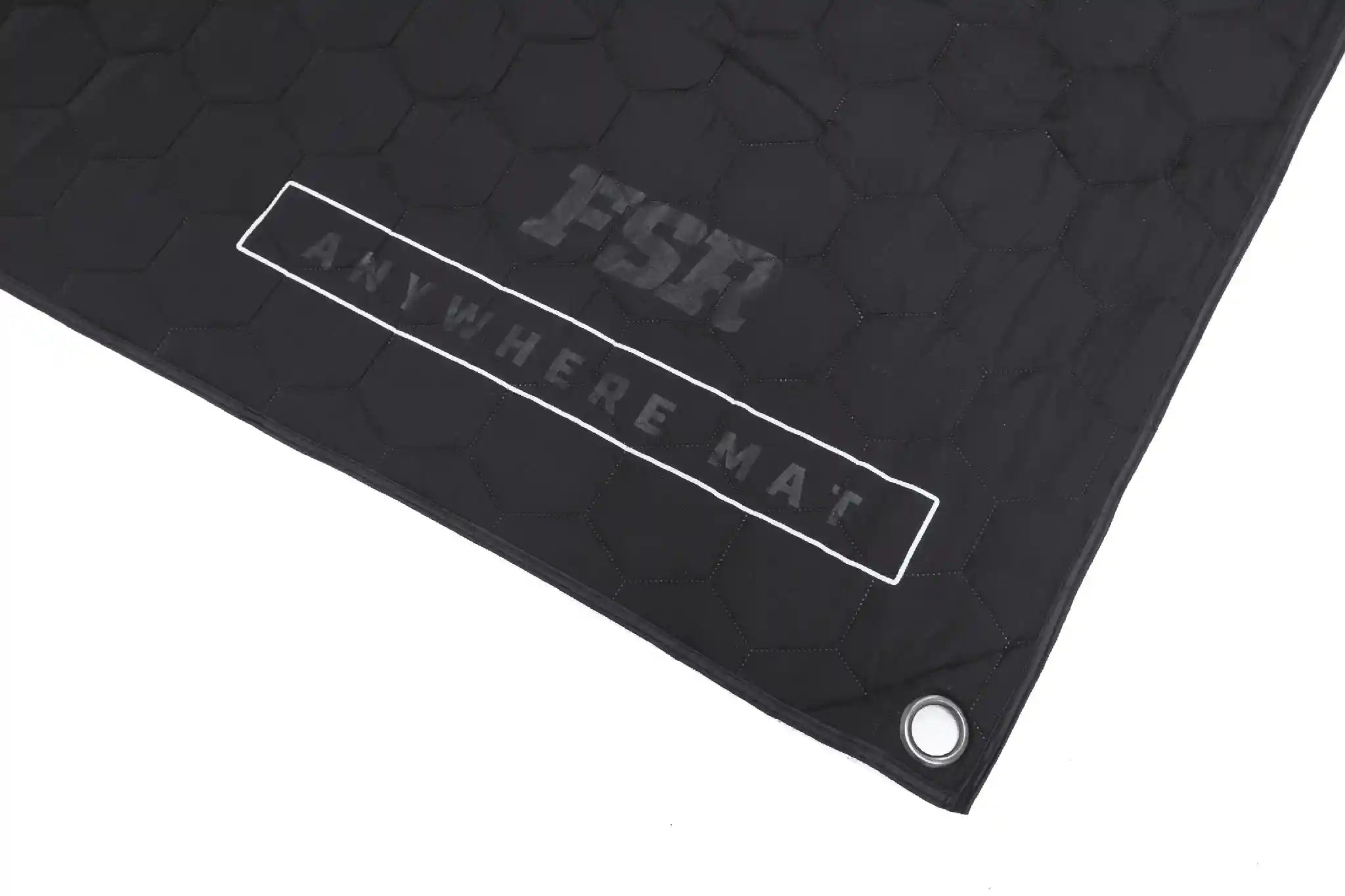 Close up of the FSR Anywhere Camping Mat branding and reinforced corner grommet on a white background