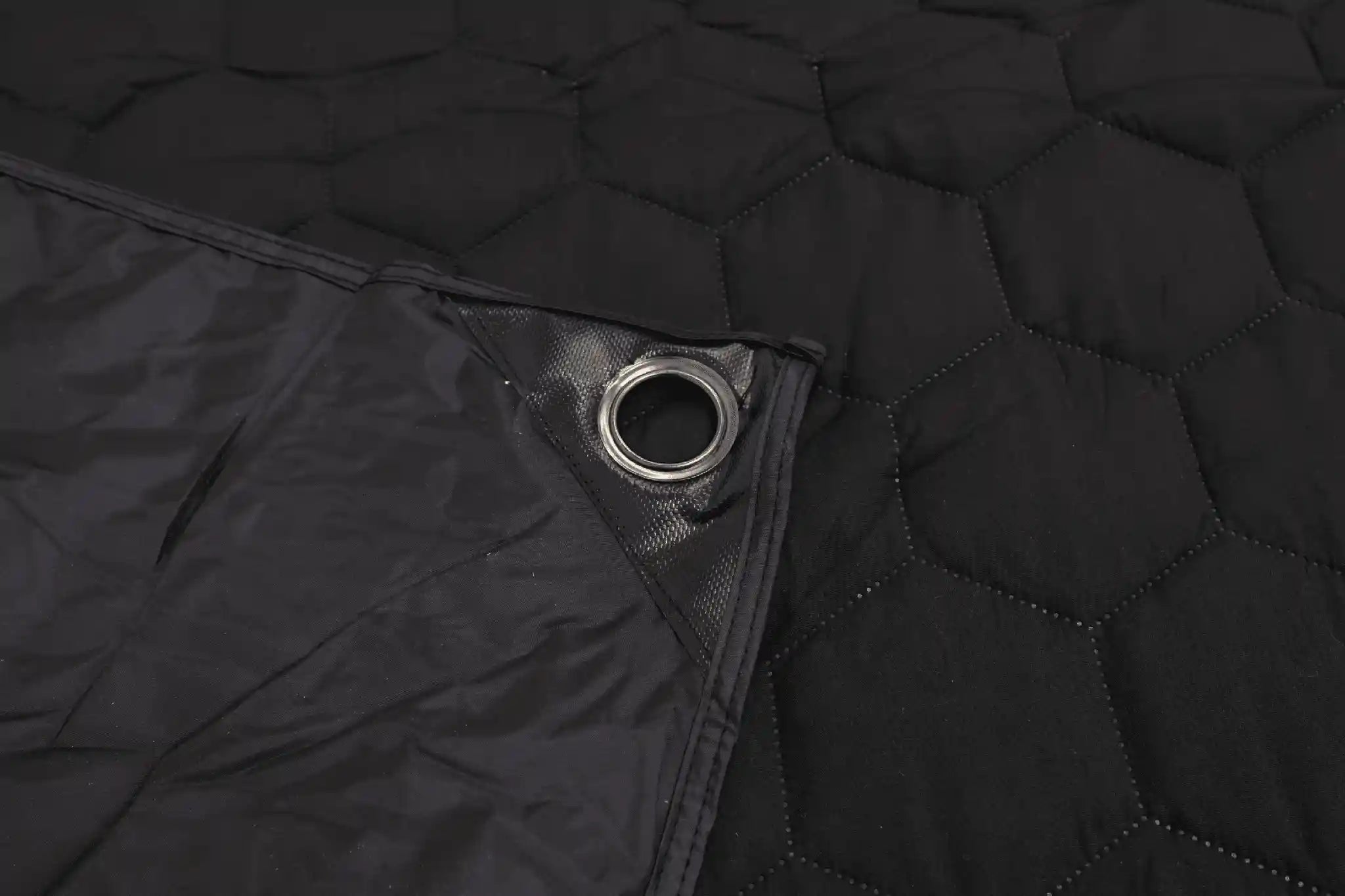 Close-up of the reinforced grommet on a the FSR Anywhere Camping Mat from Free Spirit Recreation