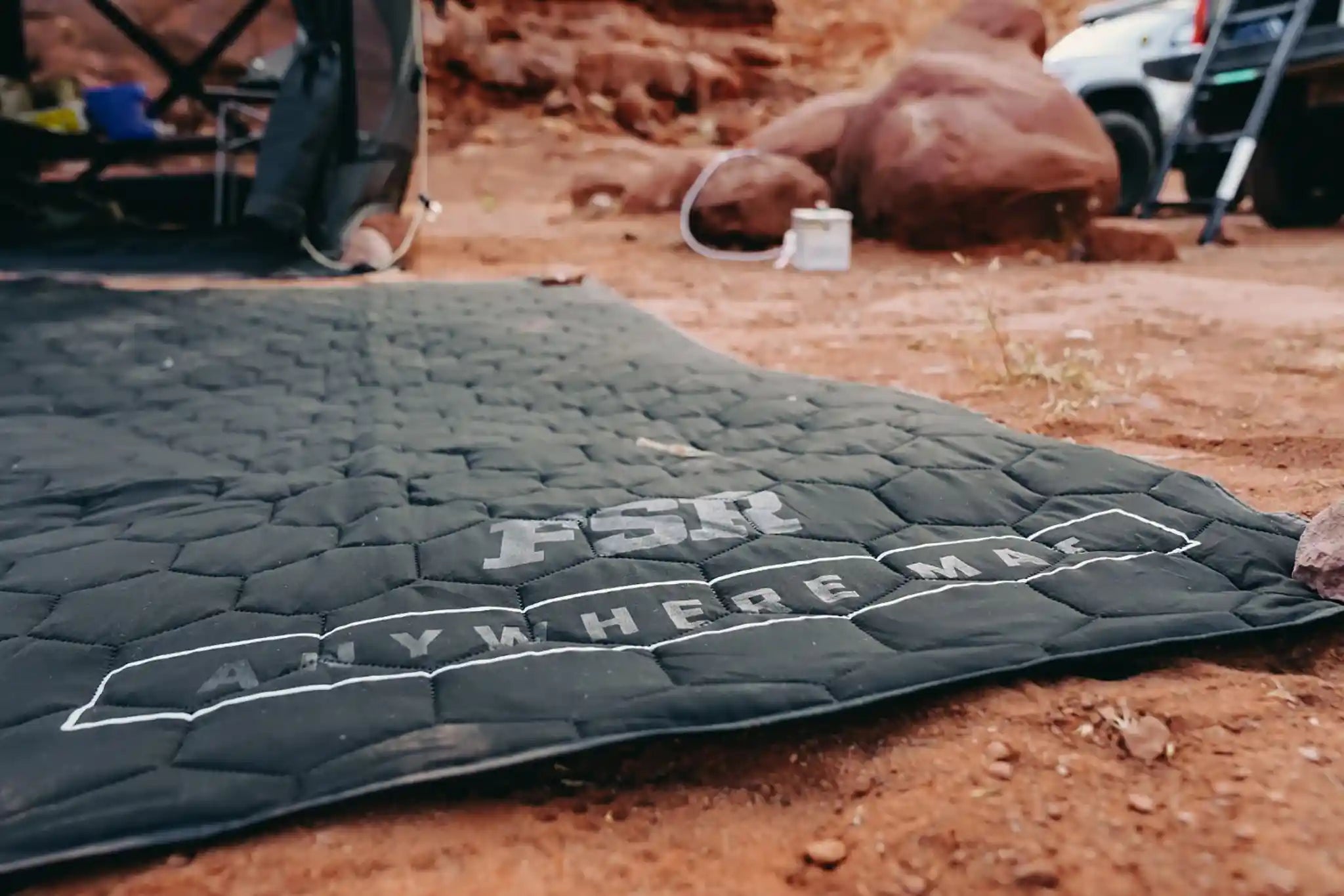 FSR Anywhere Camping Mat in use as a ground pad at a red rock campsite in Moab
