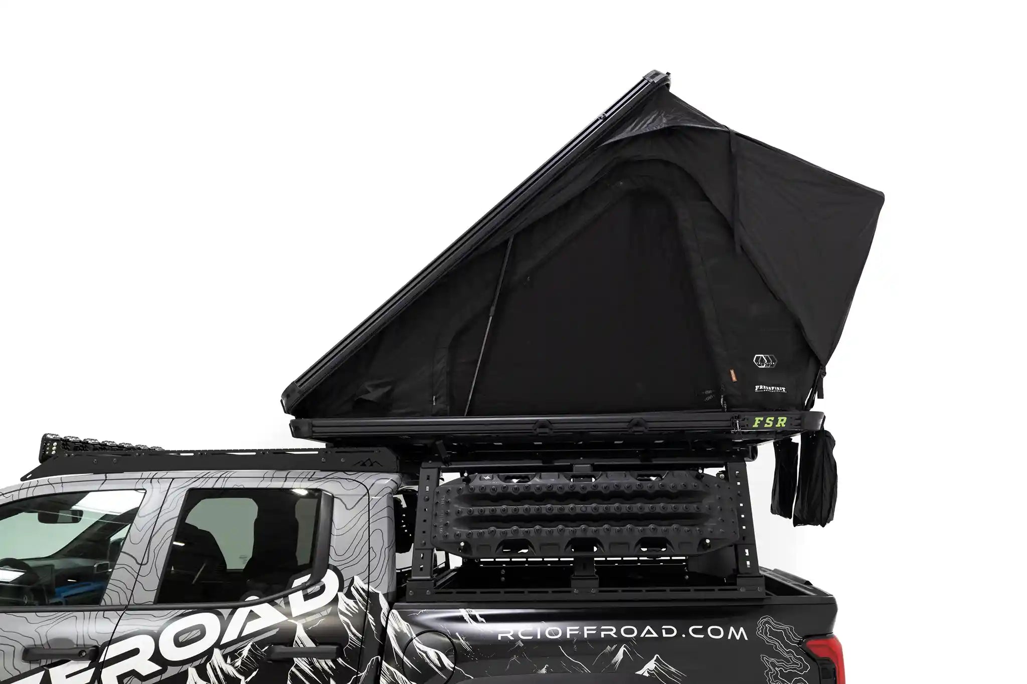 Side profile, close up photo of FSR Aspen Pro Standard roof top tent from Freespirit Recreation mounted on the bed of a short bed Toyota Tacoma pickup.