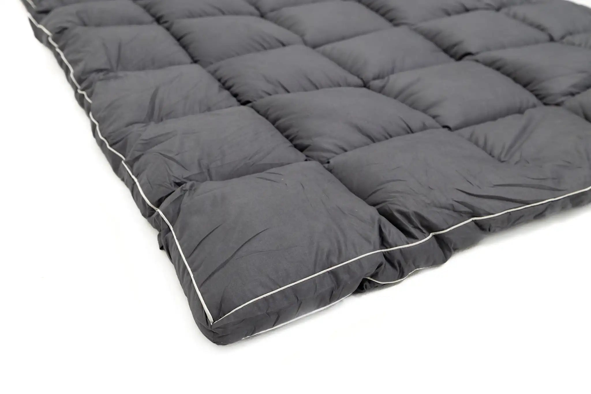 Close up of the premium gray fabric used on the FSR quilted mattress topper for rooftop tents from Free Spirit Recreation