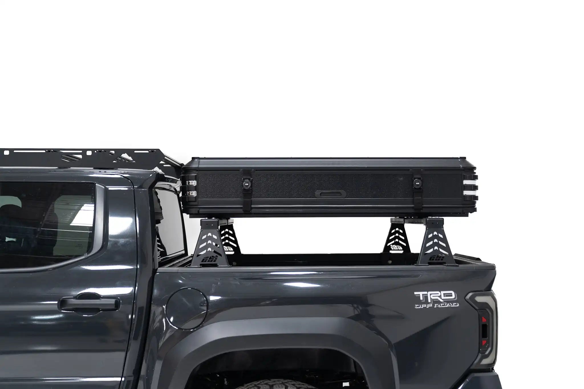 Close-up side profile exterior photo of a closed Kali hardshell rooftop tent by FSR on the truck bed of a 4th gen Toyota Tacoma.