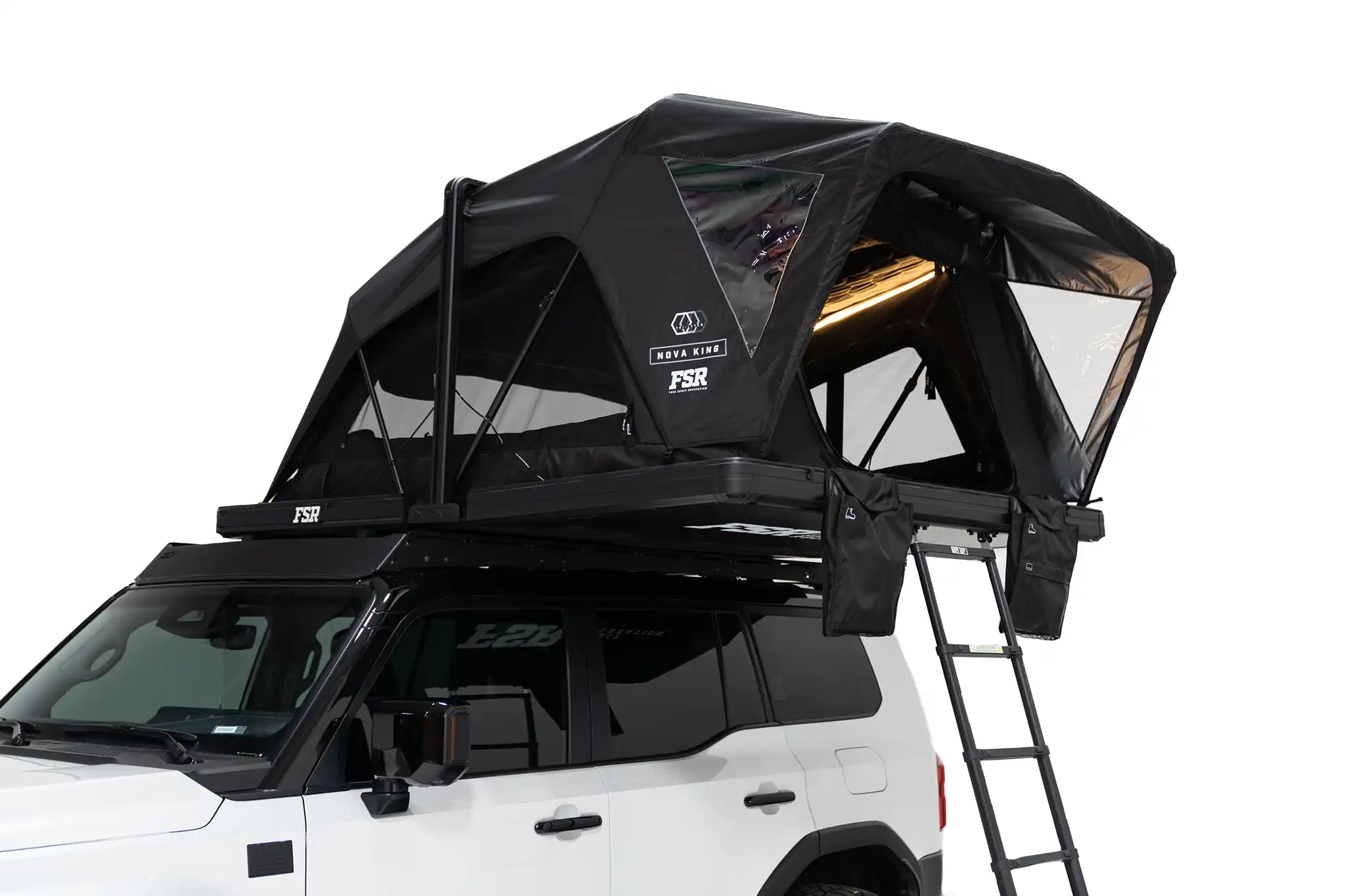 Close-up exterior photo of the Nova King rooftop tent mounted with the interior LED tent lights on.