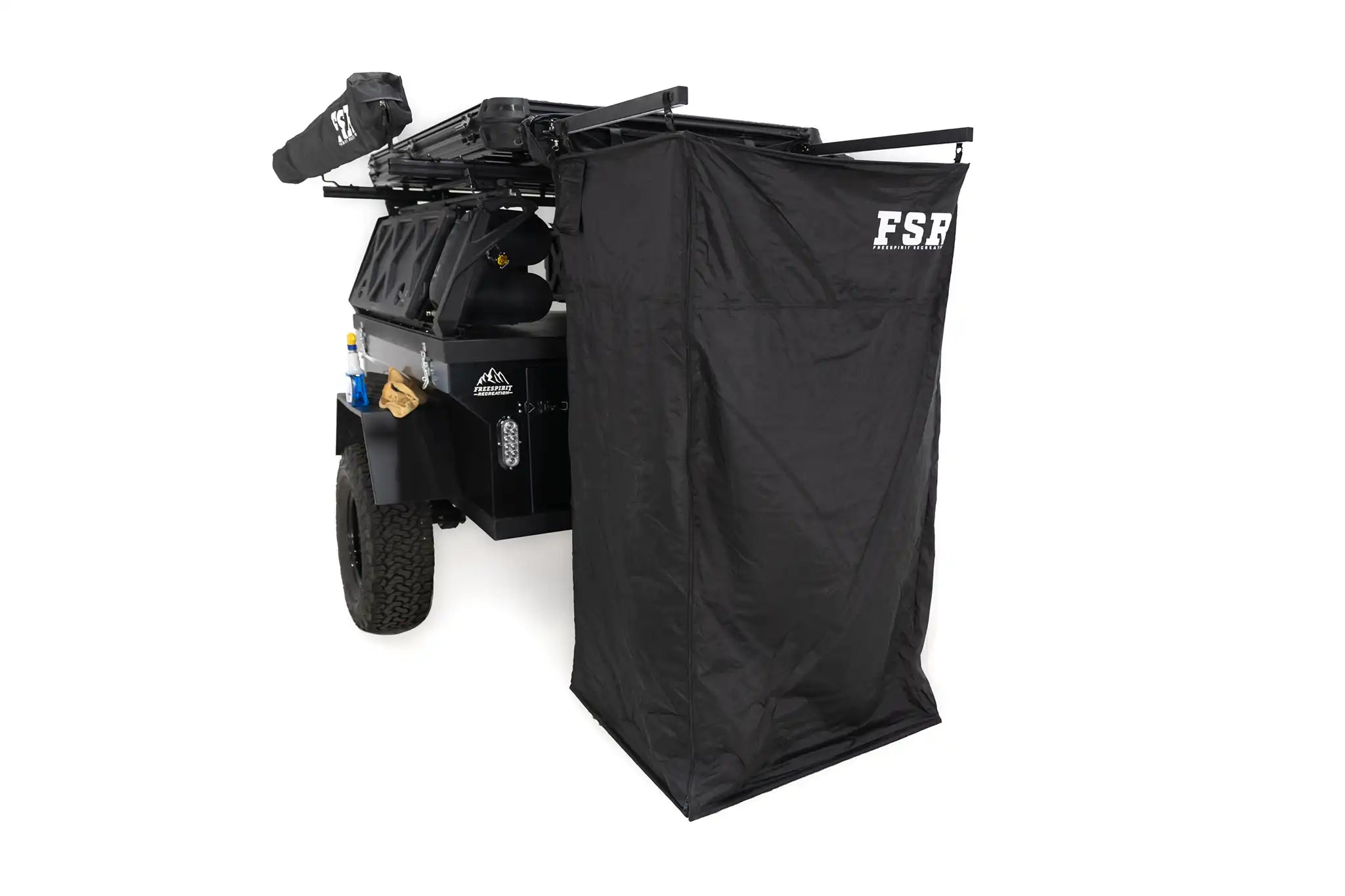 Image of the open FSR Shower Awning from Freespirit Recreation mounted to the back of an overland trailer to use as a camping shower and bathroom tent