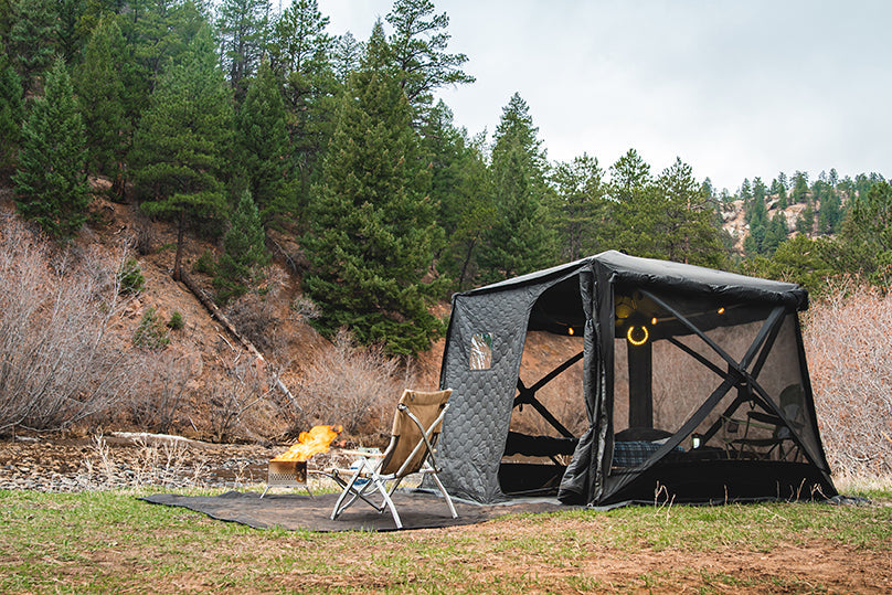 FSR Hub quick-pitch camping tent setup at a river-side campsite