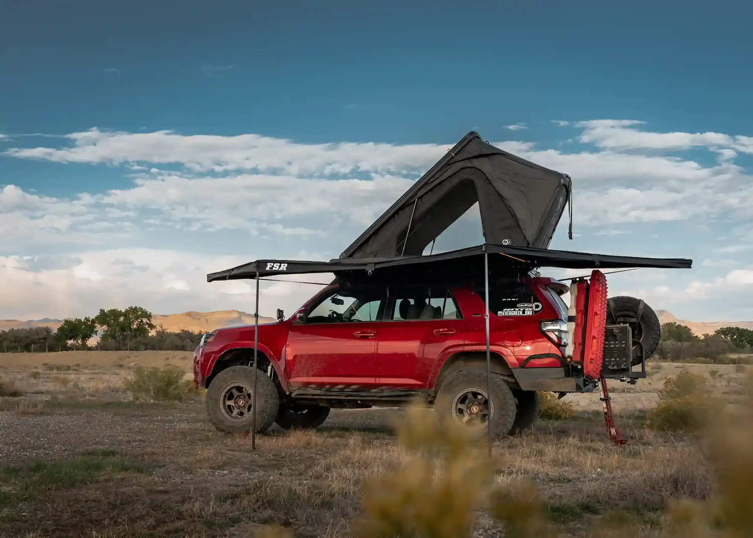 FSR Overland Awning mounted to a red Toyota 4Runner overlanding vehicle setup camping in an open high-desert dispersed campsite