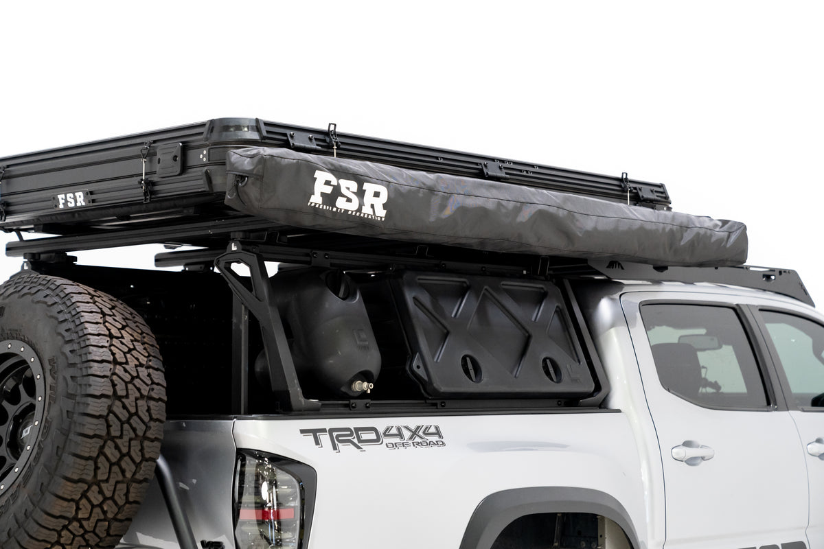 Up close photo of the 270 V2 Awning by FSR displaying the awning closed and stored away mounted to the side of a roof top tent. 