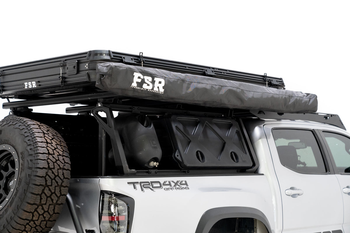 Up close photo of the 270 V2 Awning by FSR displaying the awning closed and stored away mounted to the side of a roof top tent. 