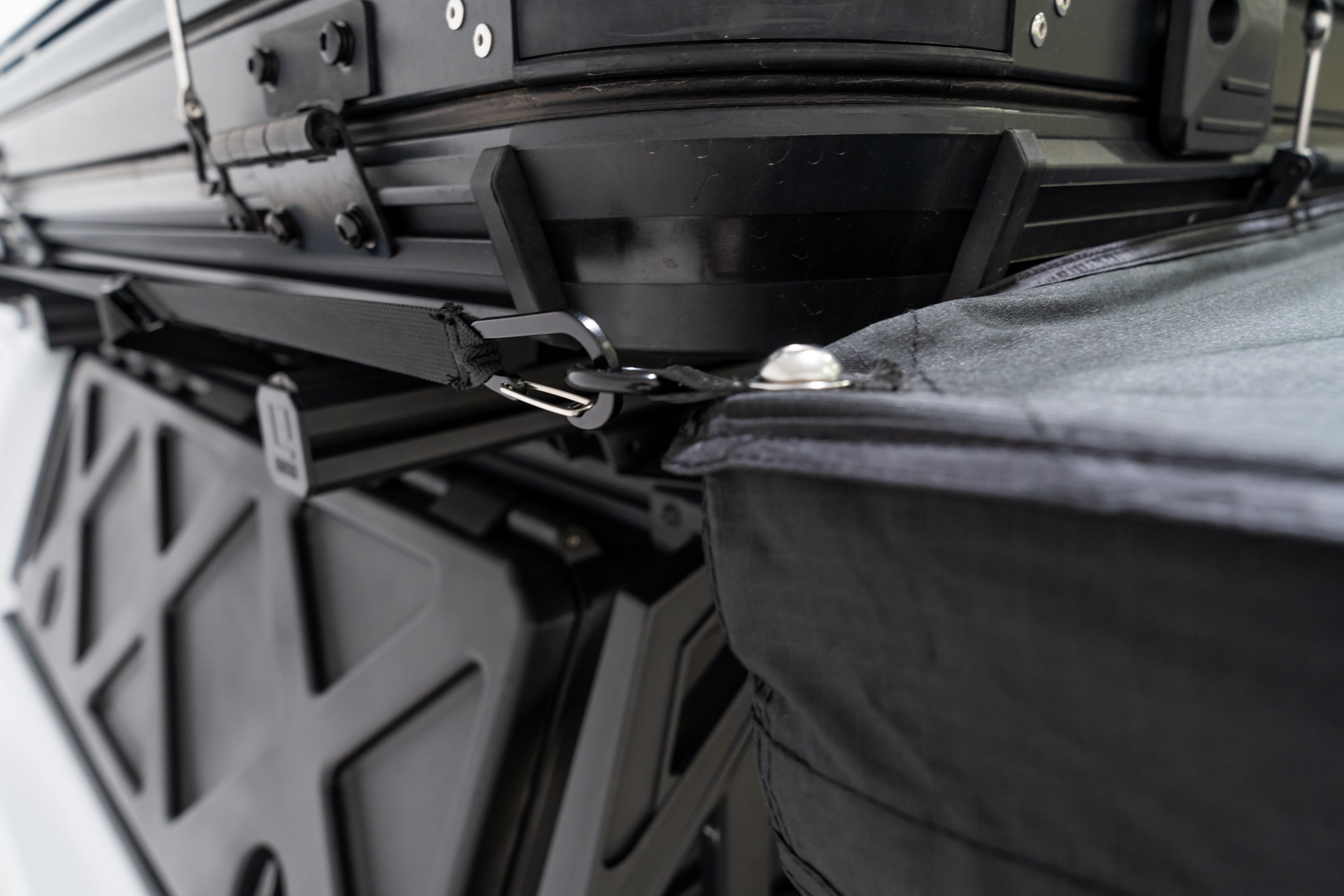 Photo of the carabiner attachment point on the 270 V2 Awning by FSR secured to the side of the roof top tent.