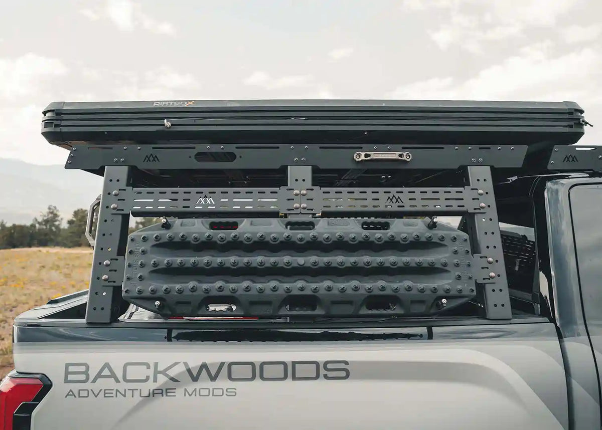 Backwoods Adventure Mods Bed Rack DRIFTR Topper cargo carrier installed on  a 2022+ 3rd Gen Toyota Tundra bed rack with a roof top tent mounted on top | Free Spirit Recreation
