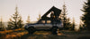 Fsr aspen pro standard deployed on a 4runner at camo with a woman in the tent and dog at the bottom of the ladder