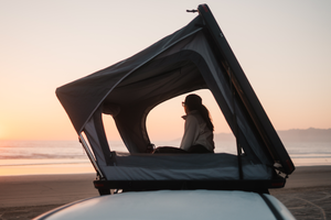 Gazing at Sunset on a beach in a Freespirit Odyssey rooftop tent