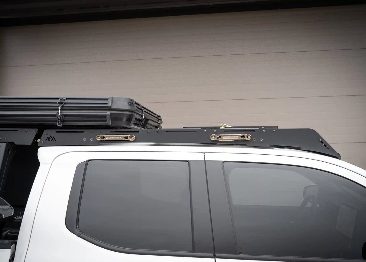 White Toyota Tacoma with a Backwoods Adventure Mods Roof Rack & Bed Rack installed with an FSR Rooftop Tent mounted on top as part of a Bundle Deal
