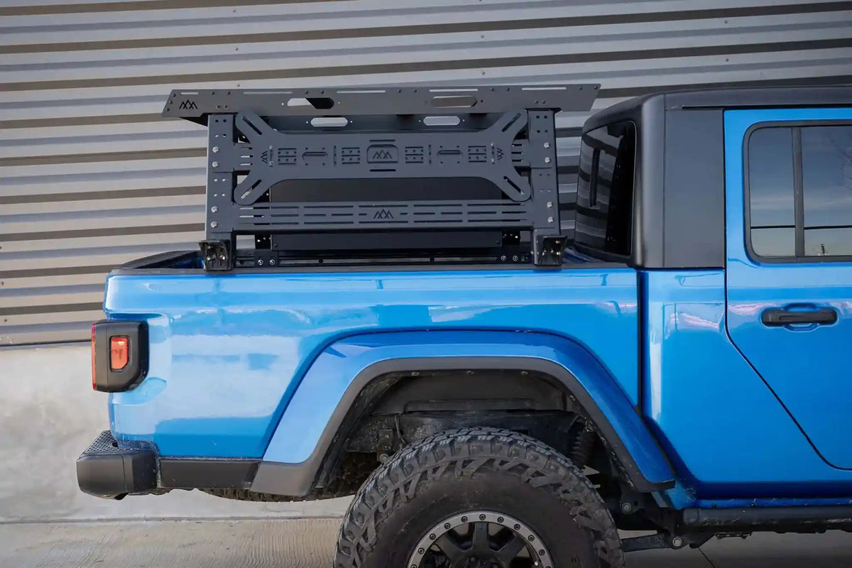 Blue Jeep Gladiator equipped with a Backwoods Adventure Mods Bed Rack as part of the FSR Backwoods Jeep Gladiator Adventure Bundle  | Free Spirit Recreation