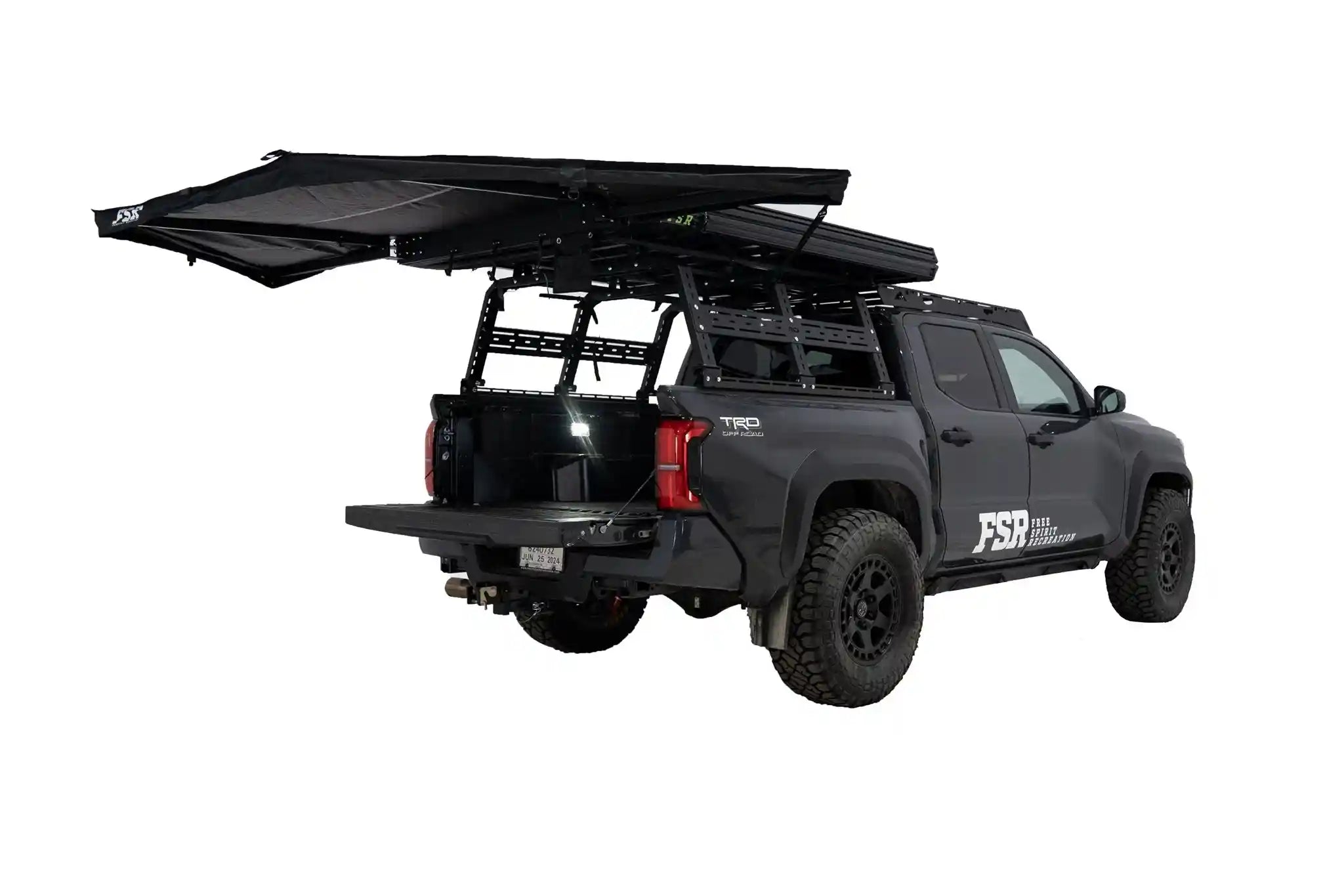 FSR 180 Tailgate Awning mounted and deployed at the rear of a black Toyota Tacoma overlanding setup for use as a rear car awning