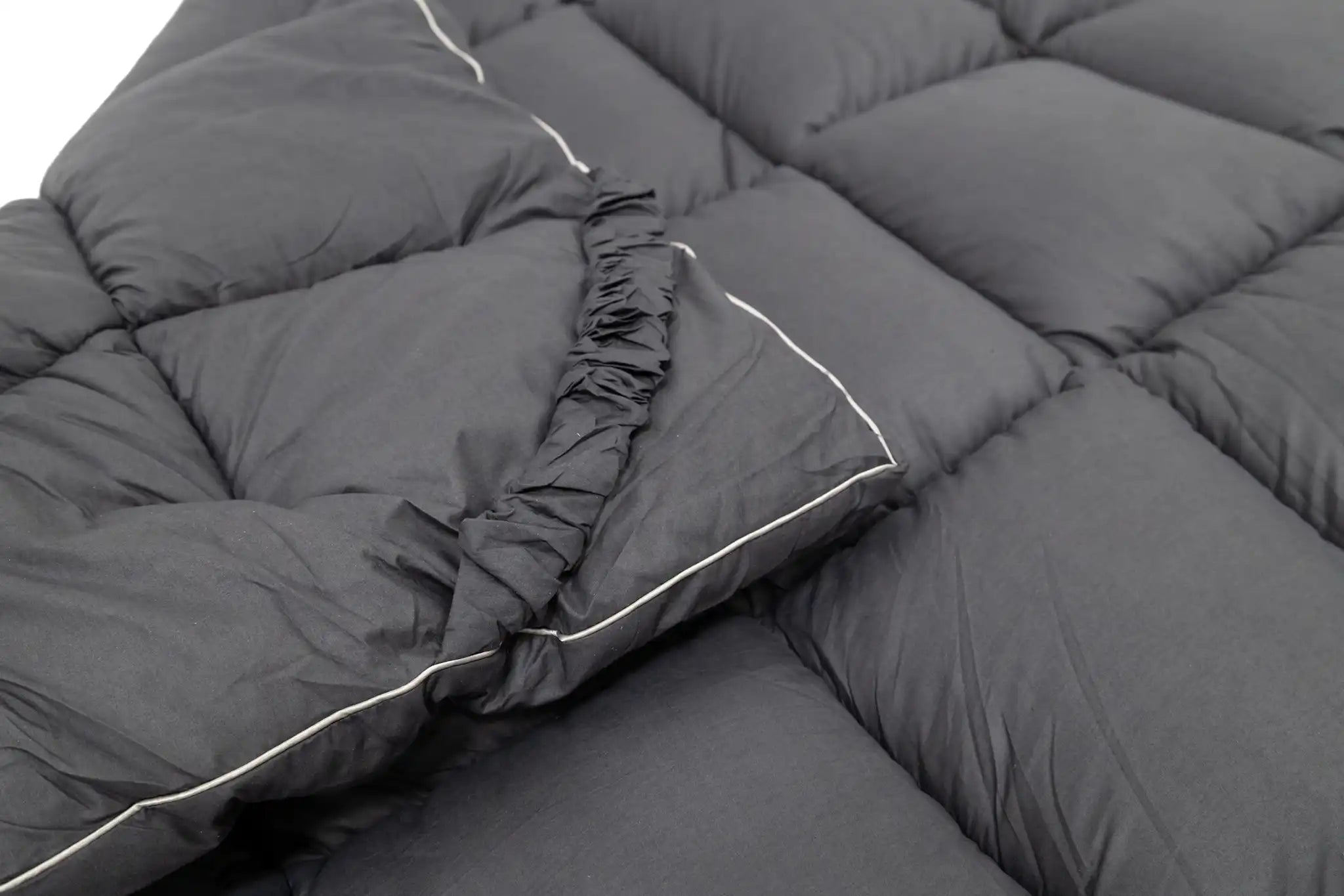 Close up of the corner of the FSR Cloud Topper rooftop tent mattress topper from Free Spirit Recreation