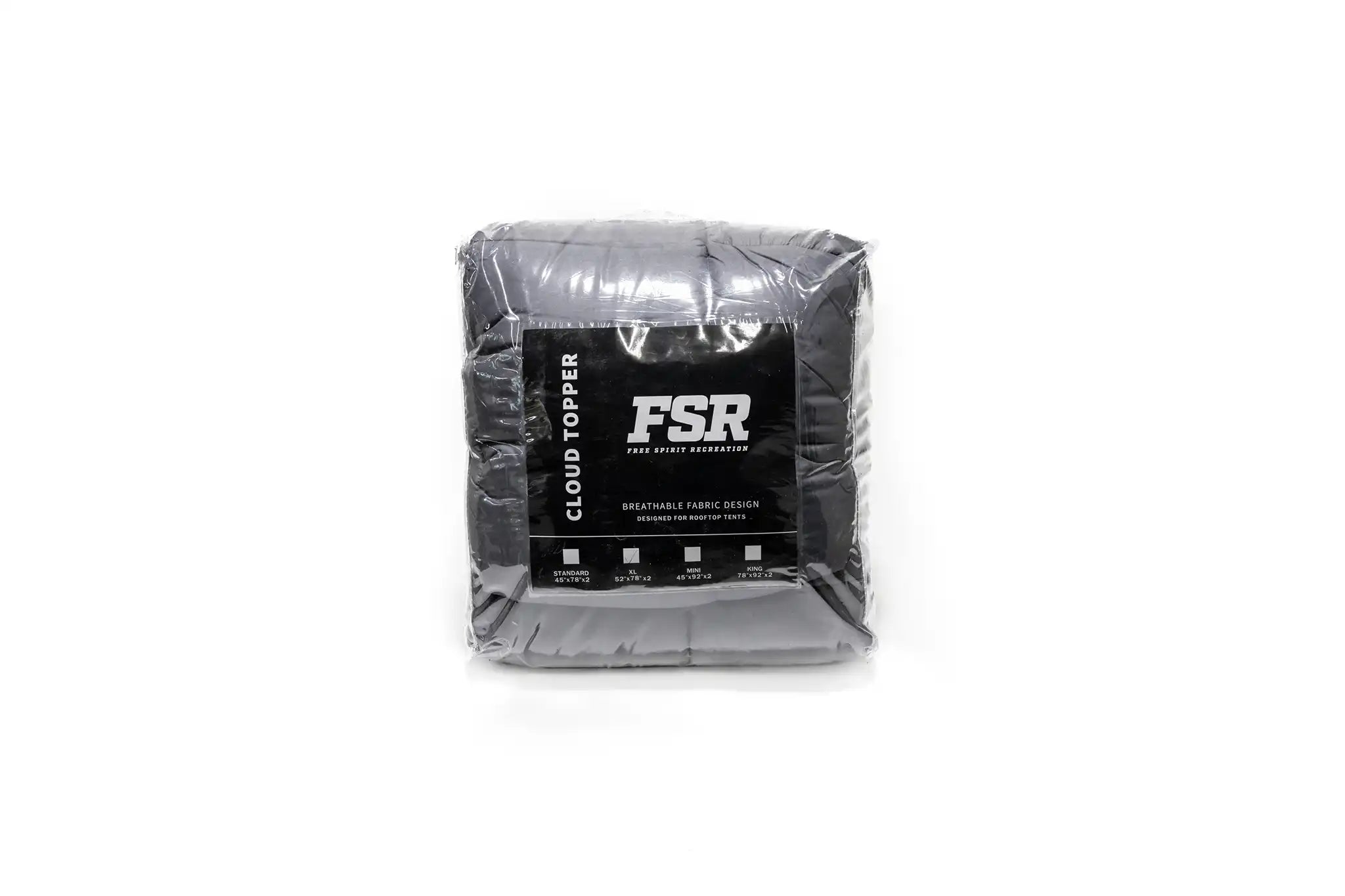 Front view of the FSR Cloud Topper rooftop tent mattress topper from Free Spirit Recreation packed in its clear plastic zippered storage bag