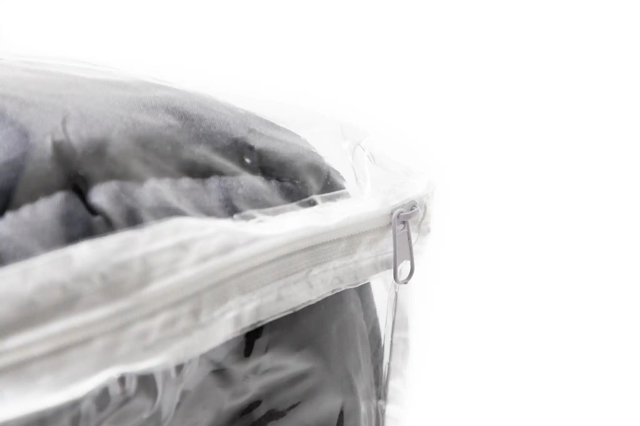 Close up image of the zipper on the FSR Cloud Topper rooftop tent mattress topper's clear plastic zippered storage bag