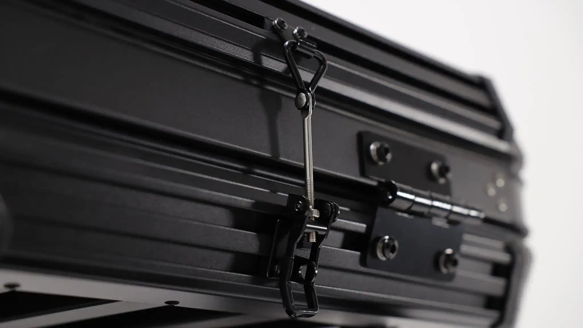 Close up photo of the FSR Evolution V2 Standard Rooftop Tent latch system on the exterior of the tent.