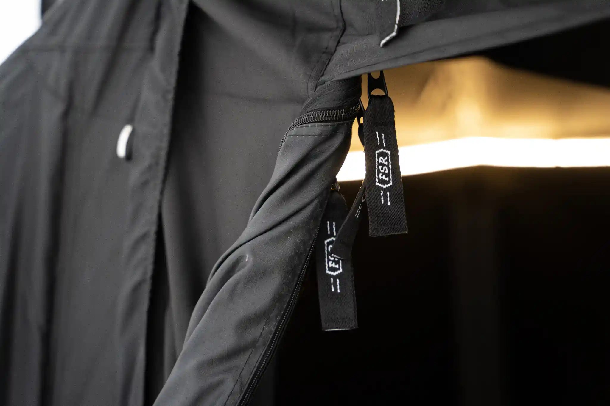 Close-up of the zippers and fabric of the FSR 4XL Tent Car Connect car camping attachment